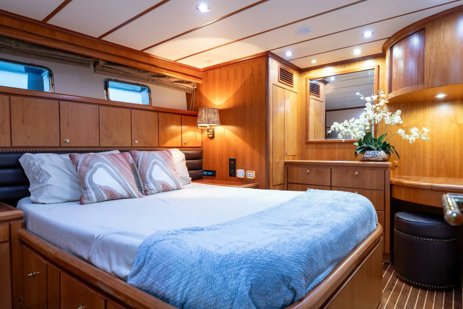 a bed with a white pillow aboard UN WINE Yacht for Sale