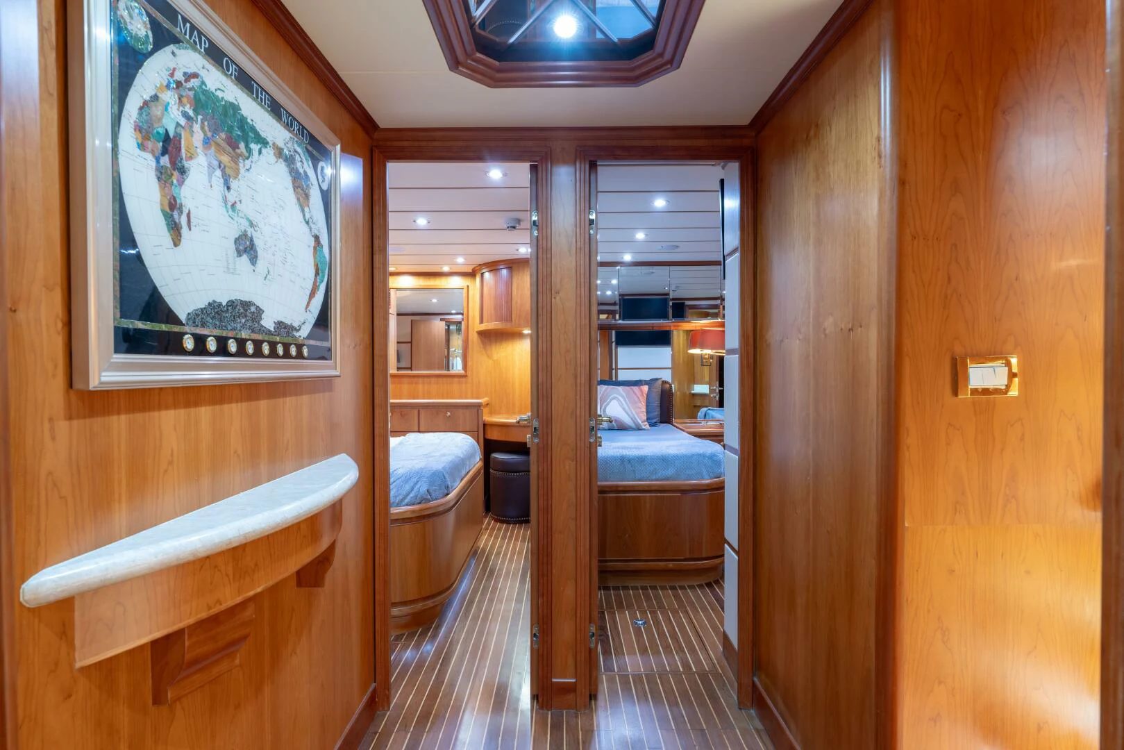 a room with a bed and a chair aboard UN WINE Yacht for Sale