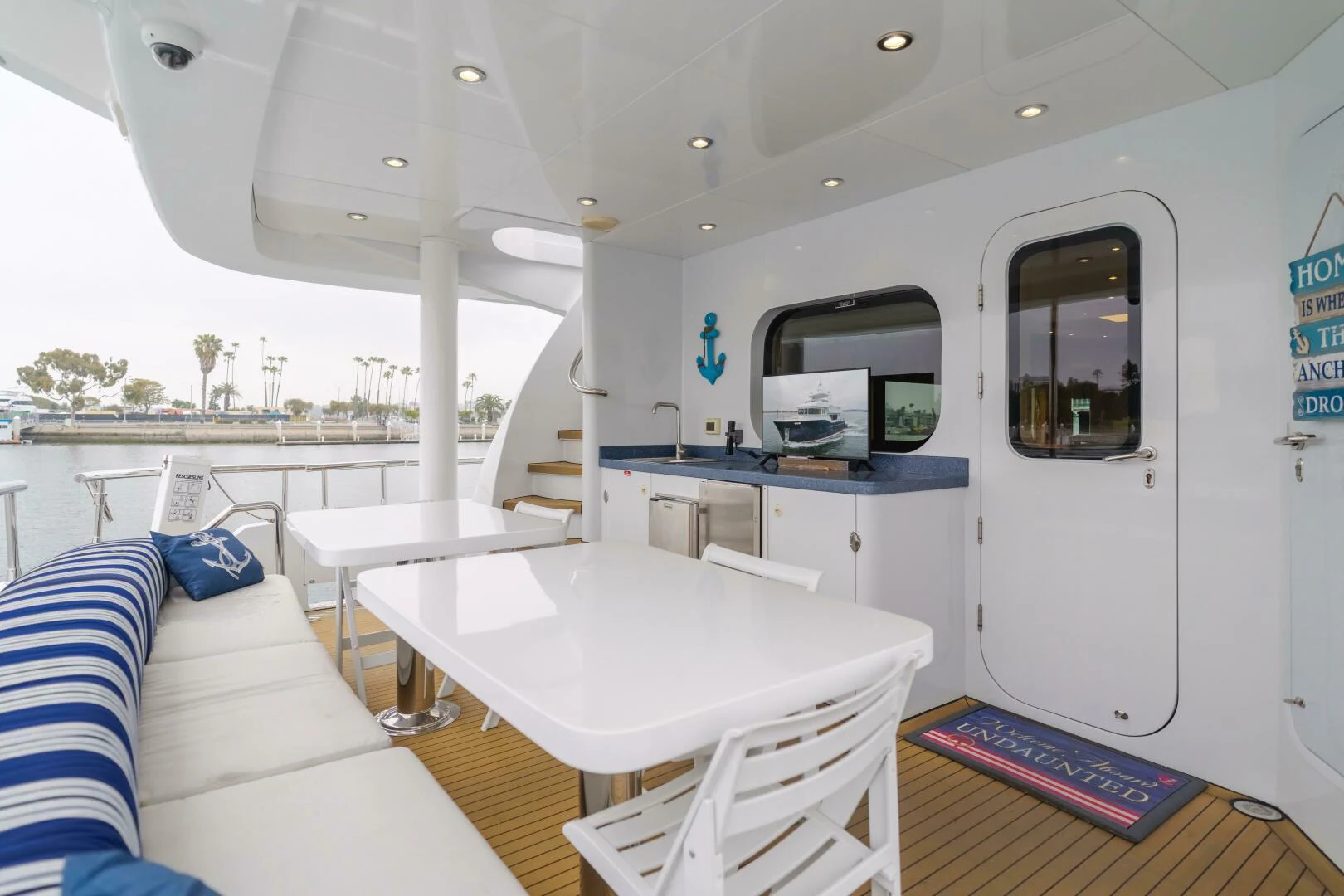 a room with a table and chairs aboard UNDAUNTED Yacht for Sale