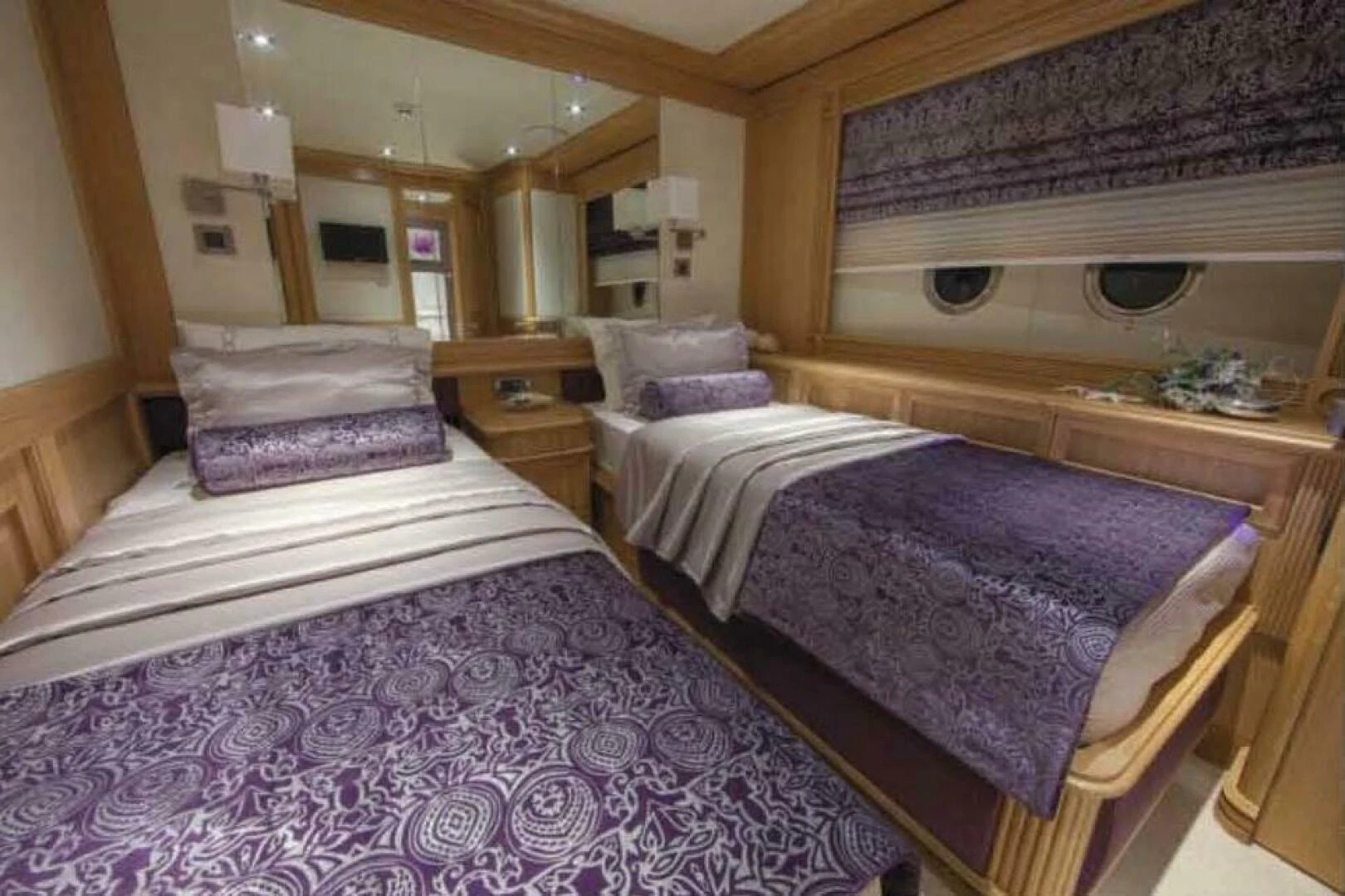 a couple of beds in a room aboard UNDAUNTED Yacht for Sale