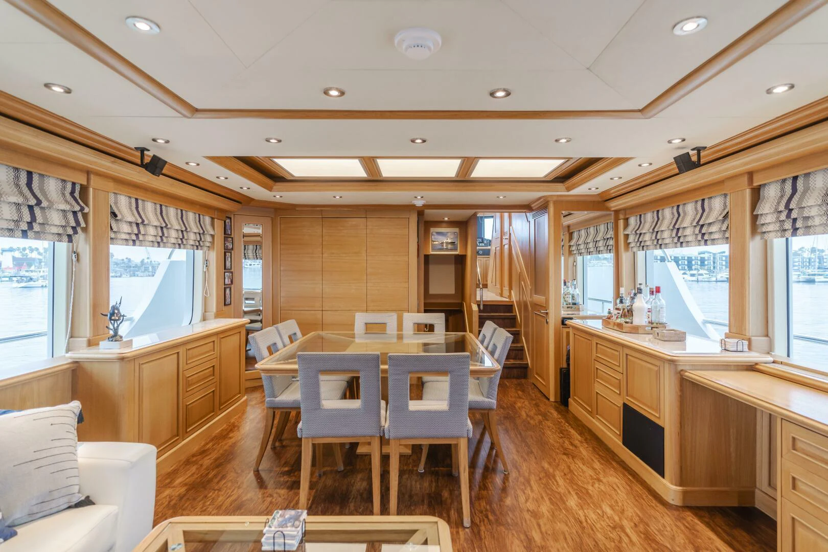 a room with tables and chairs aboard UNDAUNTED Yacht for Sale