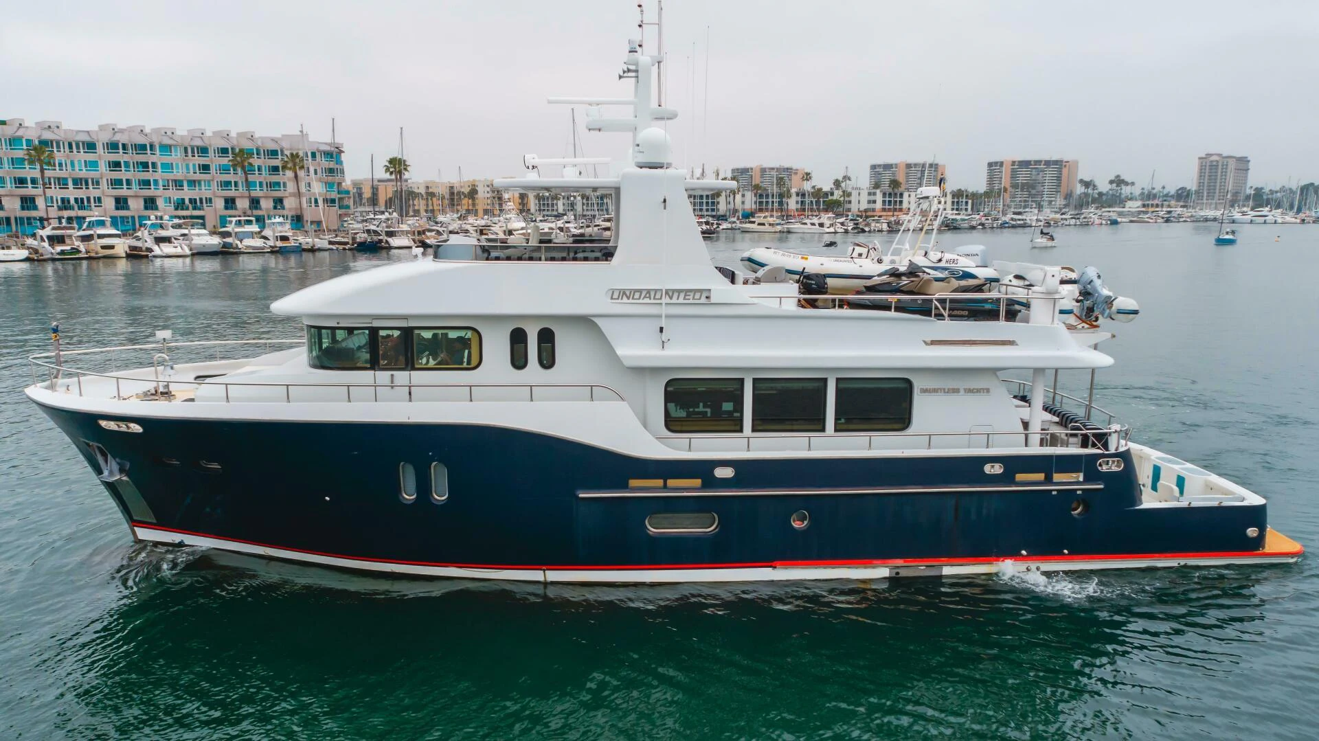 a large boat in the water aboard UNDAUNTED Yacht for Sale