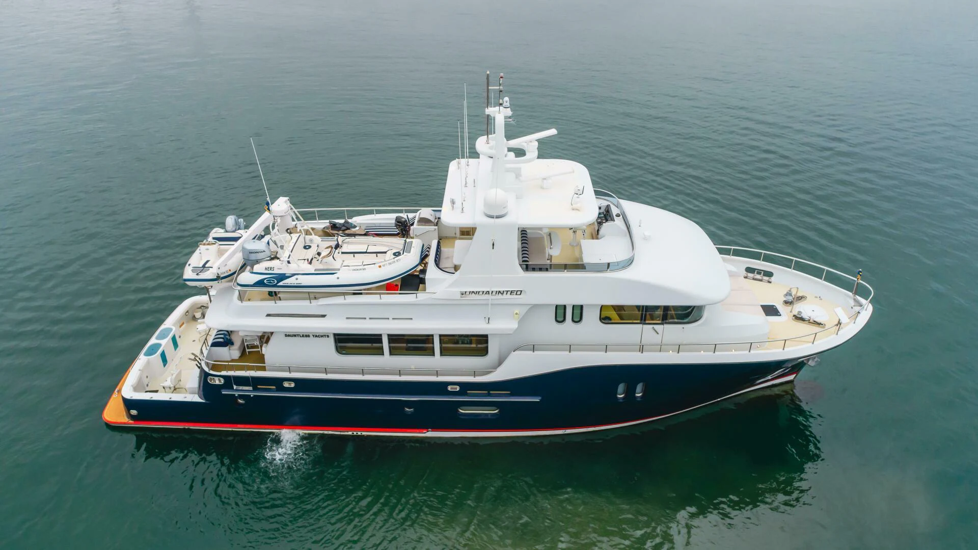 a boat in the water aboard UNDAUNTED Yacht for Sale