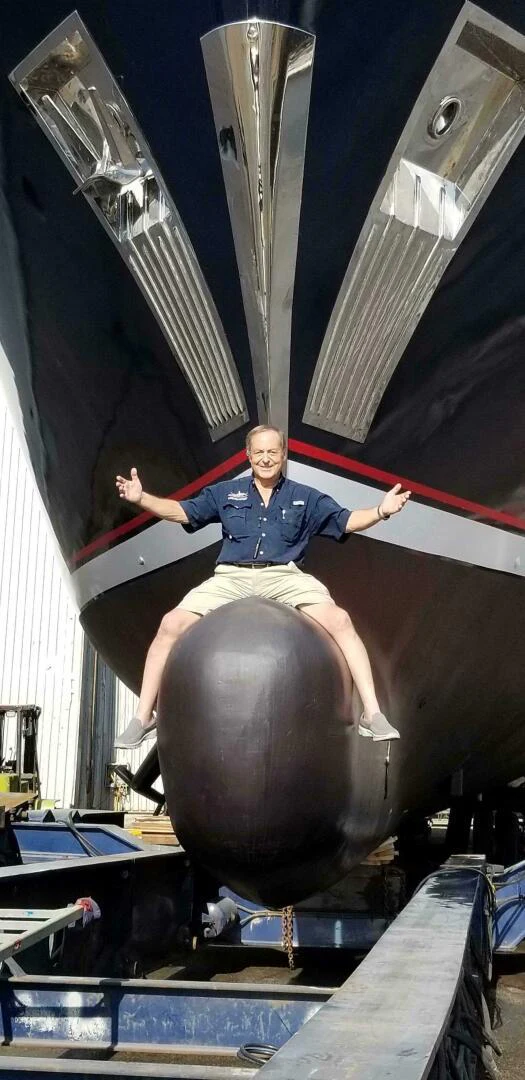 a person sitting on a large metal object aboard UNDAUNTED Yacht for Sale