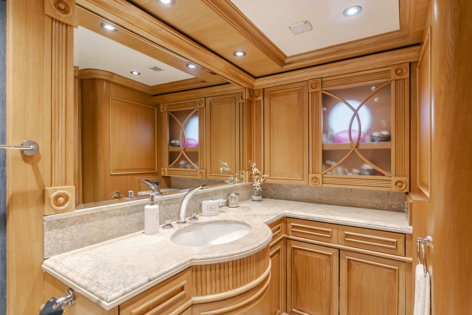 a bathroom with a large mirror aboard UNDAUNTED Yacht for Sale