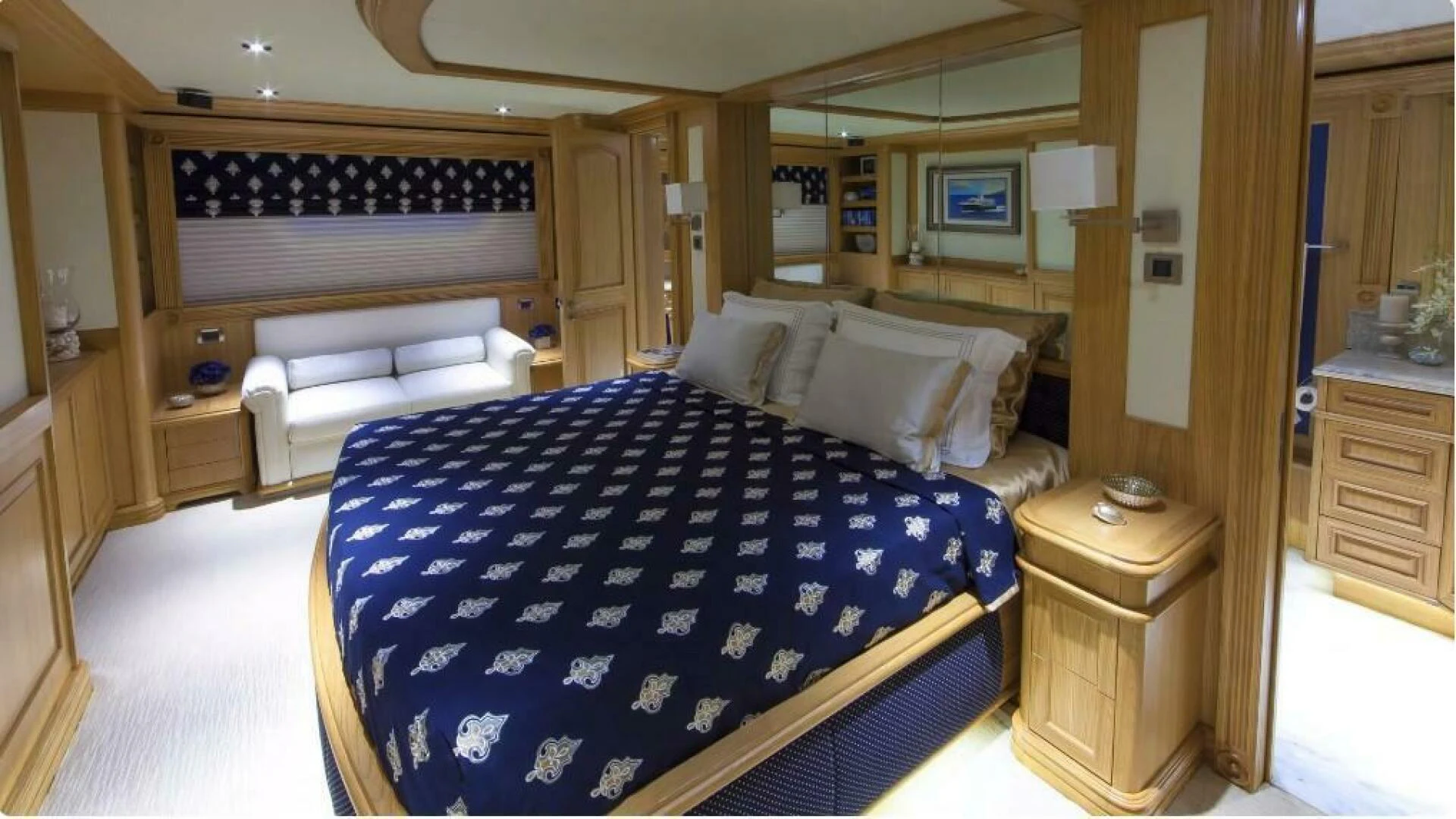 a bedroom with a bed and a desk aboard UNDAUNTED Yacht for Sale