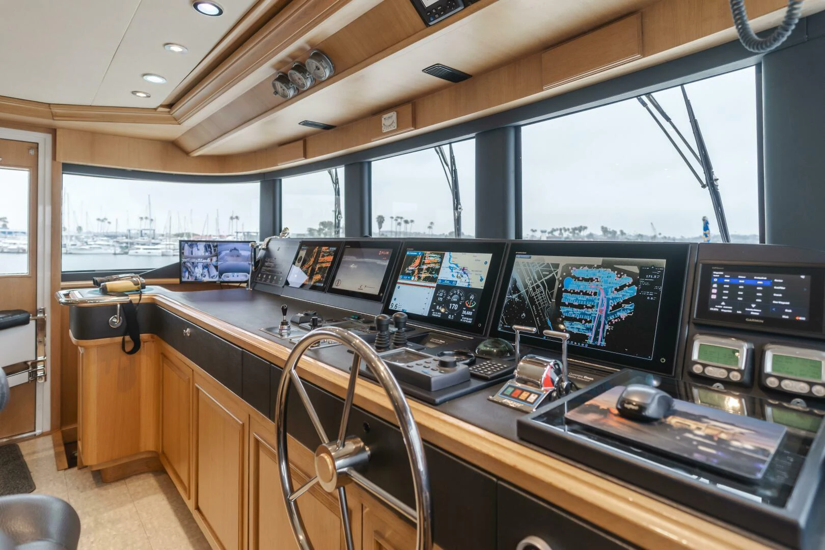 a room with many monitors and electronic equipment aboard UNDAUNTED Yacht for Sale