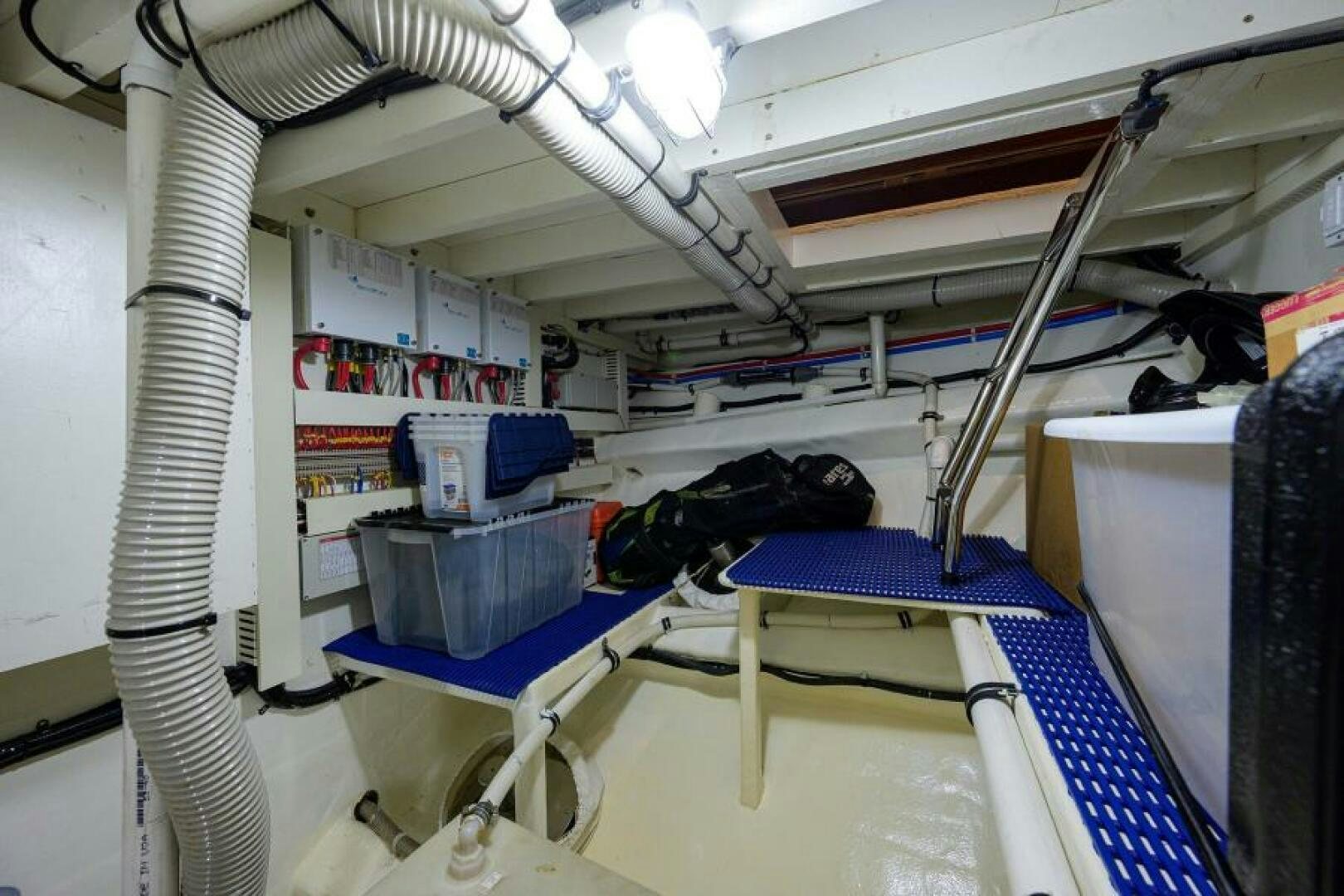 a room with a ladder and shelves aboard BARNSTAR Yacht for Sale