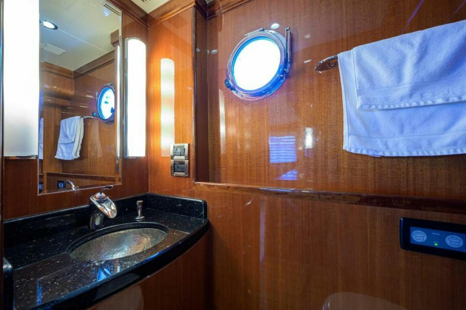 a bathroom with a sink and mirror aboard BARNSTAR Yacht for Sale