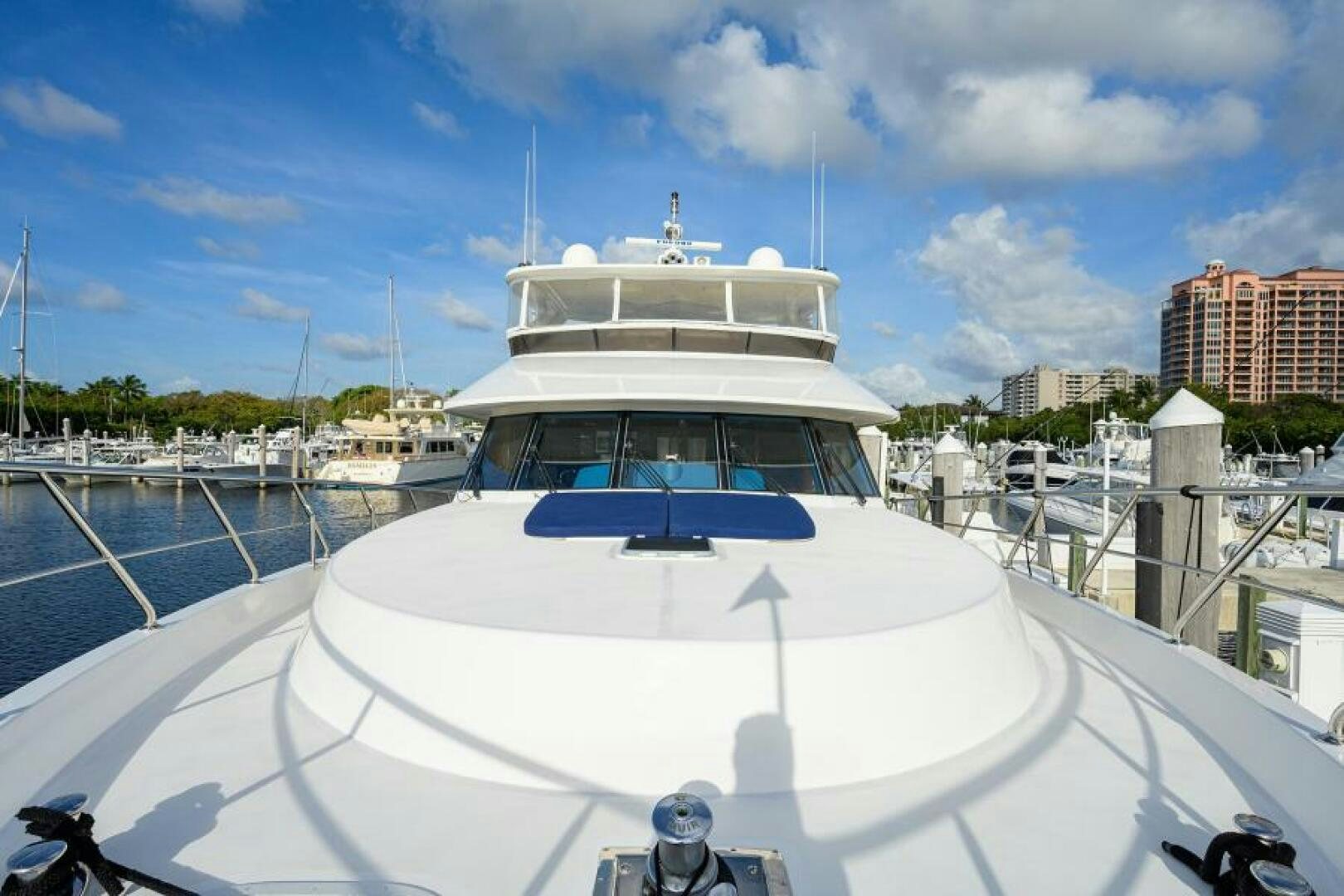 a white boat on a dock aboard BARNSTAR Yacht for Sale