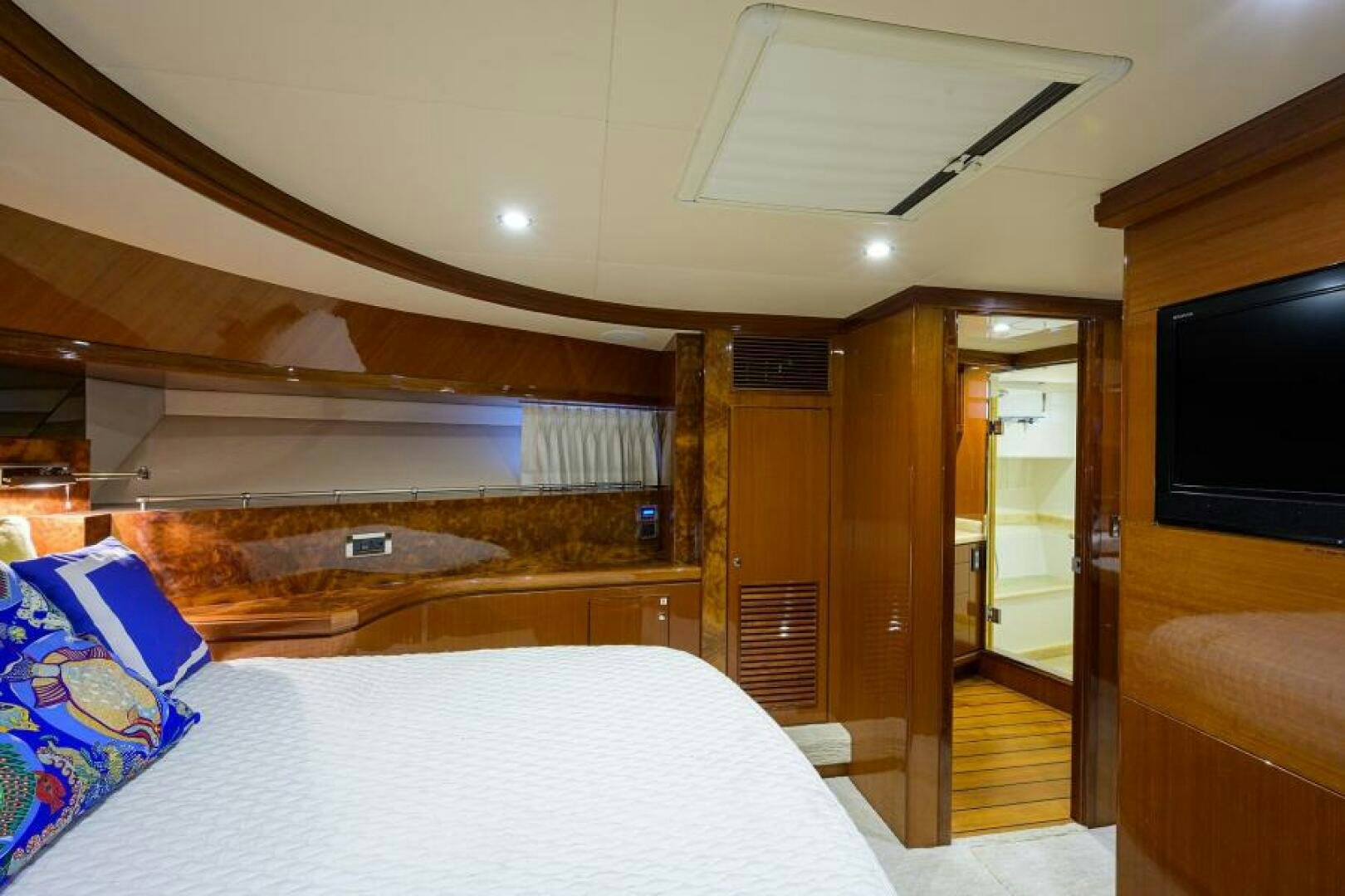 a bedroom with a bed and a television aboard BARNSTAR Yacht for Sale