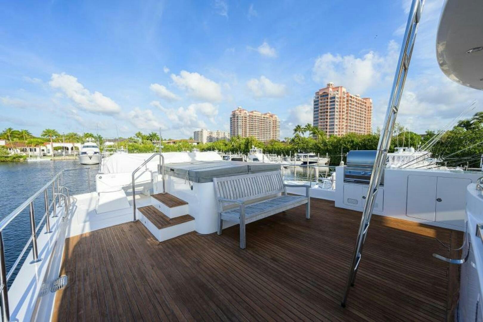 a deck with a view of a city and water aboard BARNSTAR Yacht for Sale
