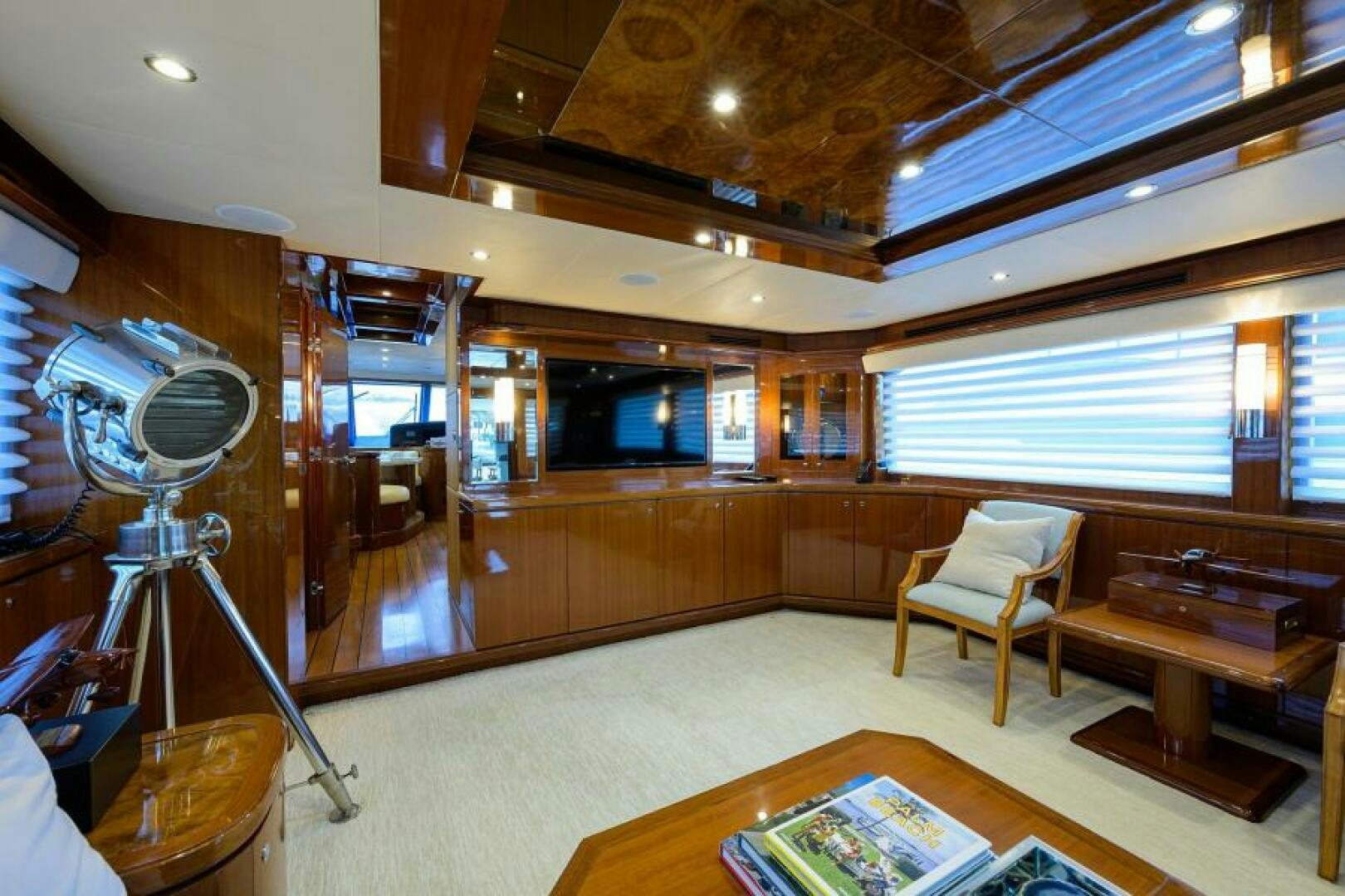 a room with a fan and chairs aboard BARNSTAR Yacht for Sale