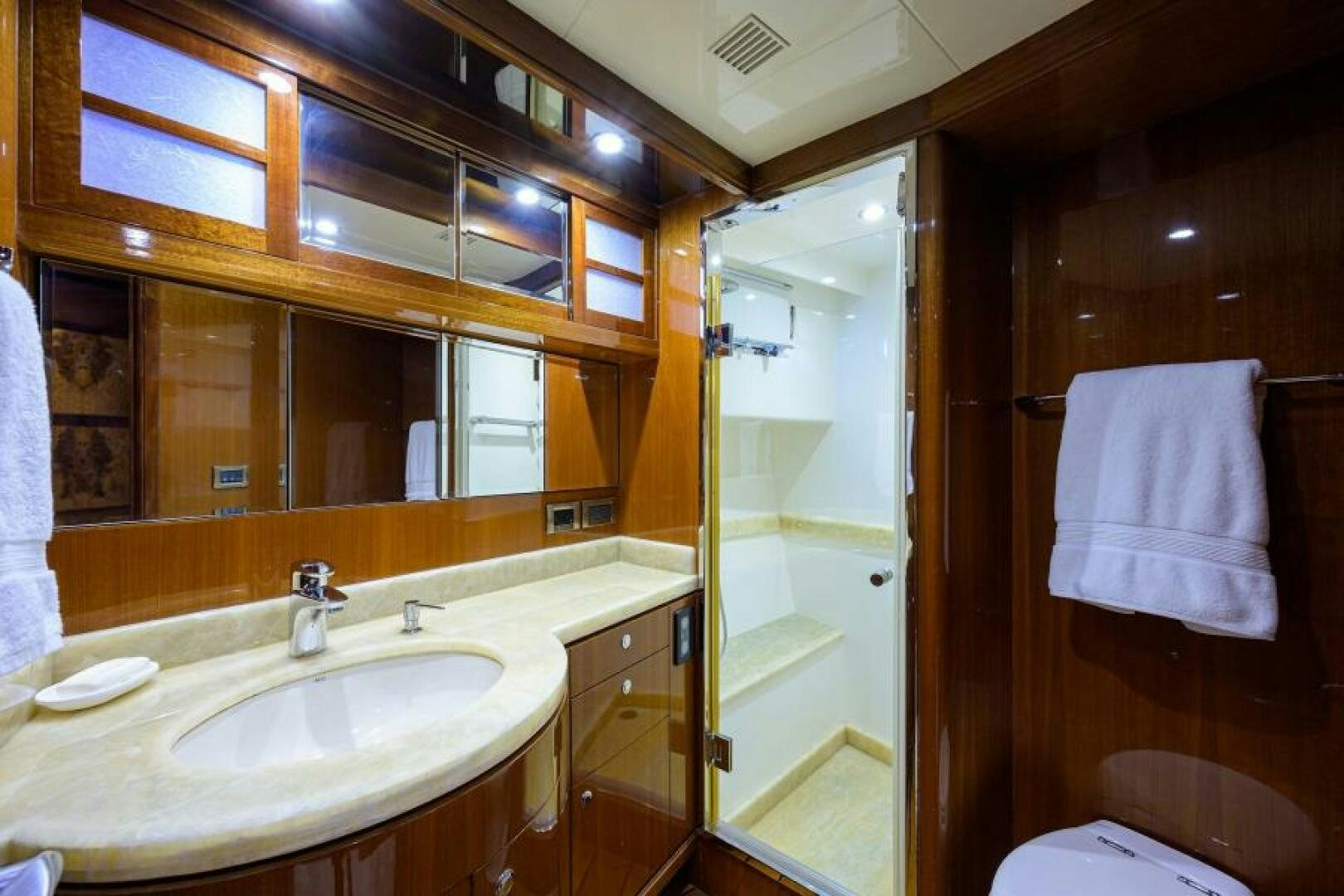a bathroom with a sink and mirror aboard BARNSTAR Yacht for Sale