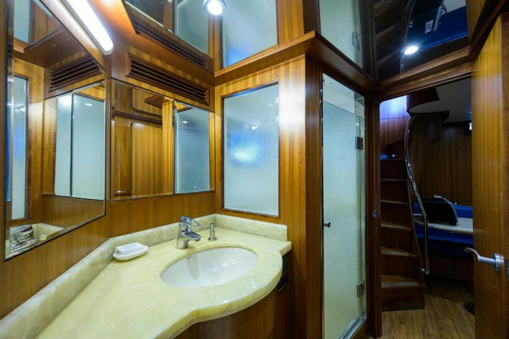 a bathroom with a sink and a mirror aboard BARNSTAR Yacht for Sale