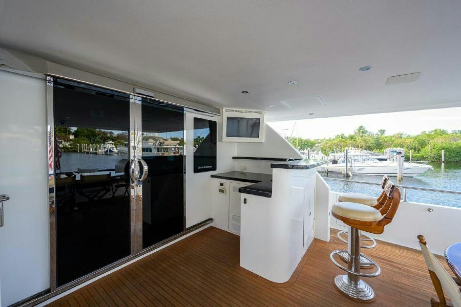 a kitchen with a table and chairs aboard BARNSTAR Yacht for Sale