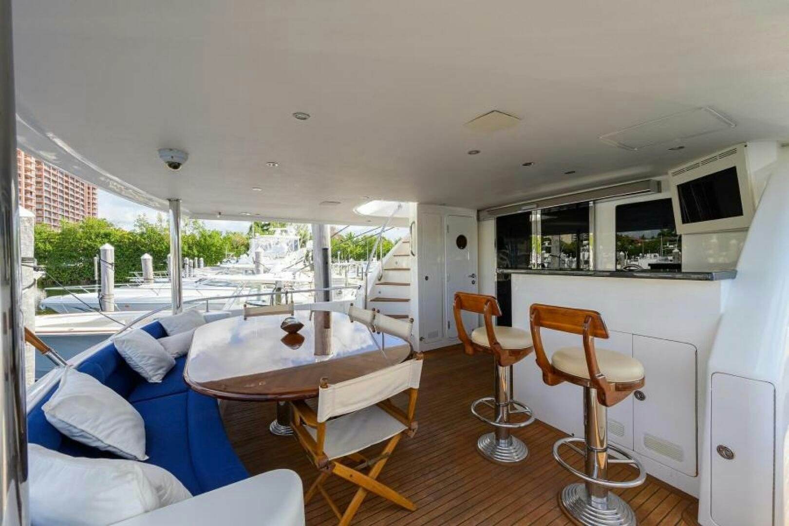 a living room with a table and chairs aboard BARNSTAR Yacht for Sale