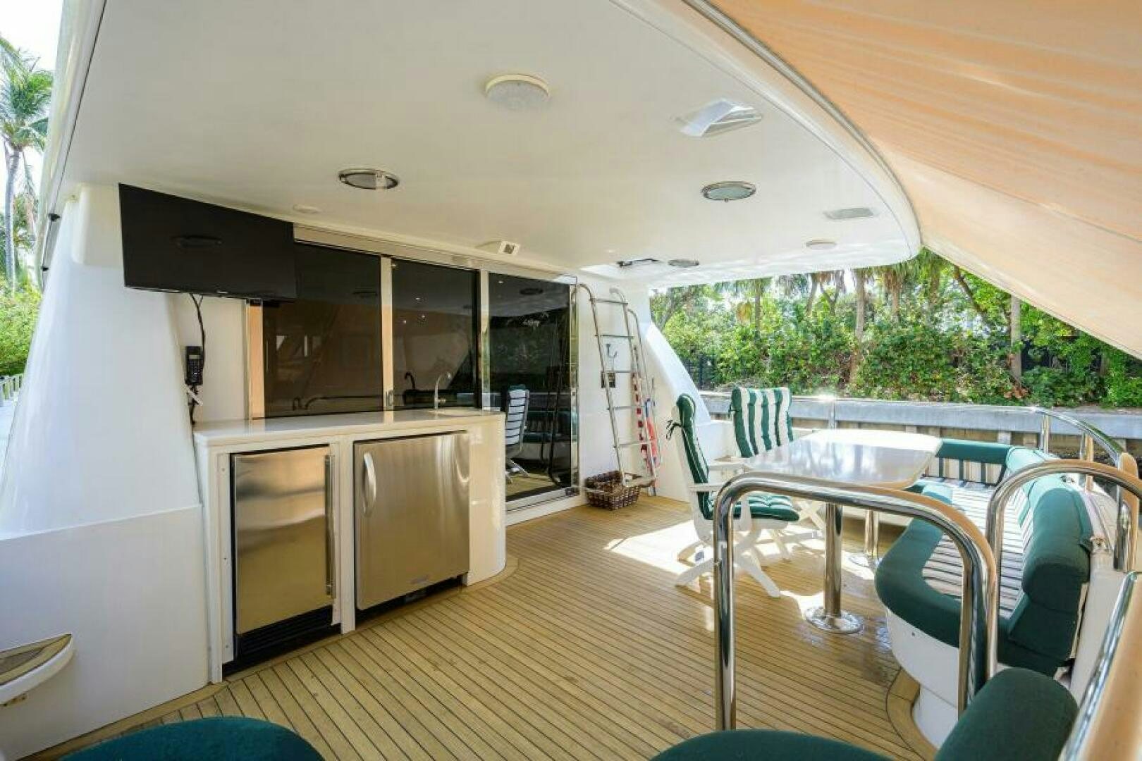 a large open kitchen and dining area aboard 80' LAZZARA Yacht for Sale
