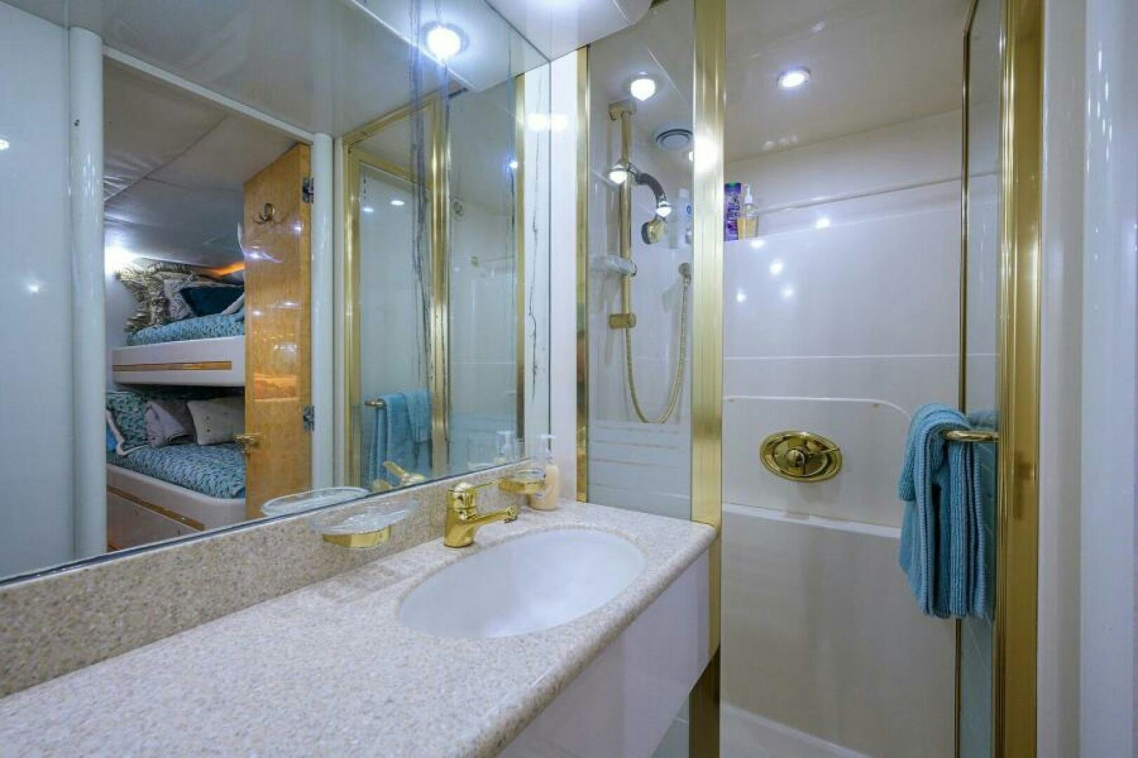 a bathroom with a large mirror aboard 80' LAZZARA Yacht for Sale