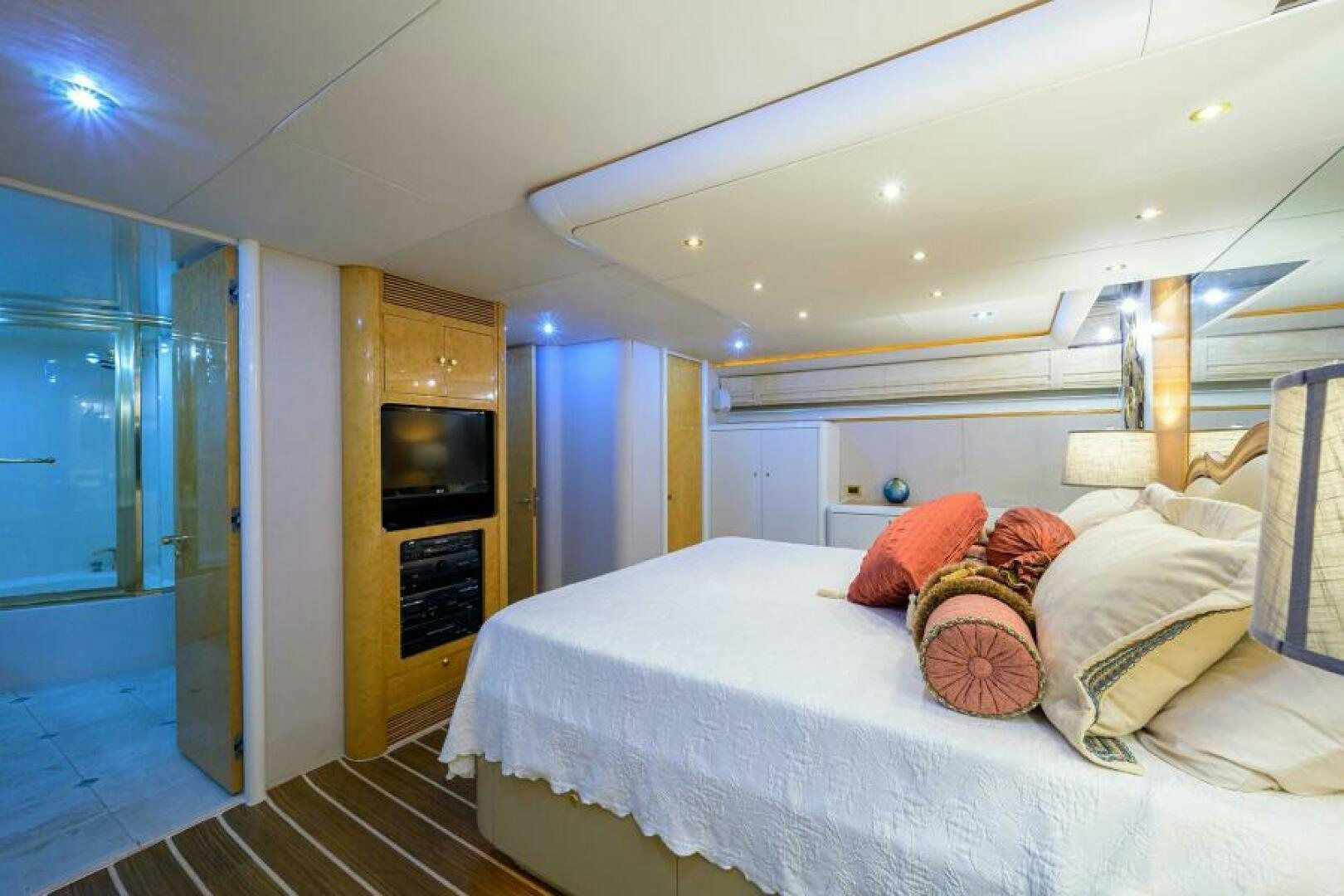 a bed in a room aboard 80' LAZZARA Yacht for Sale