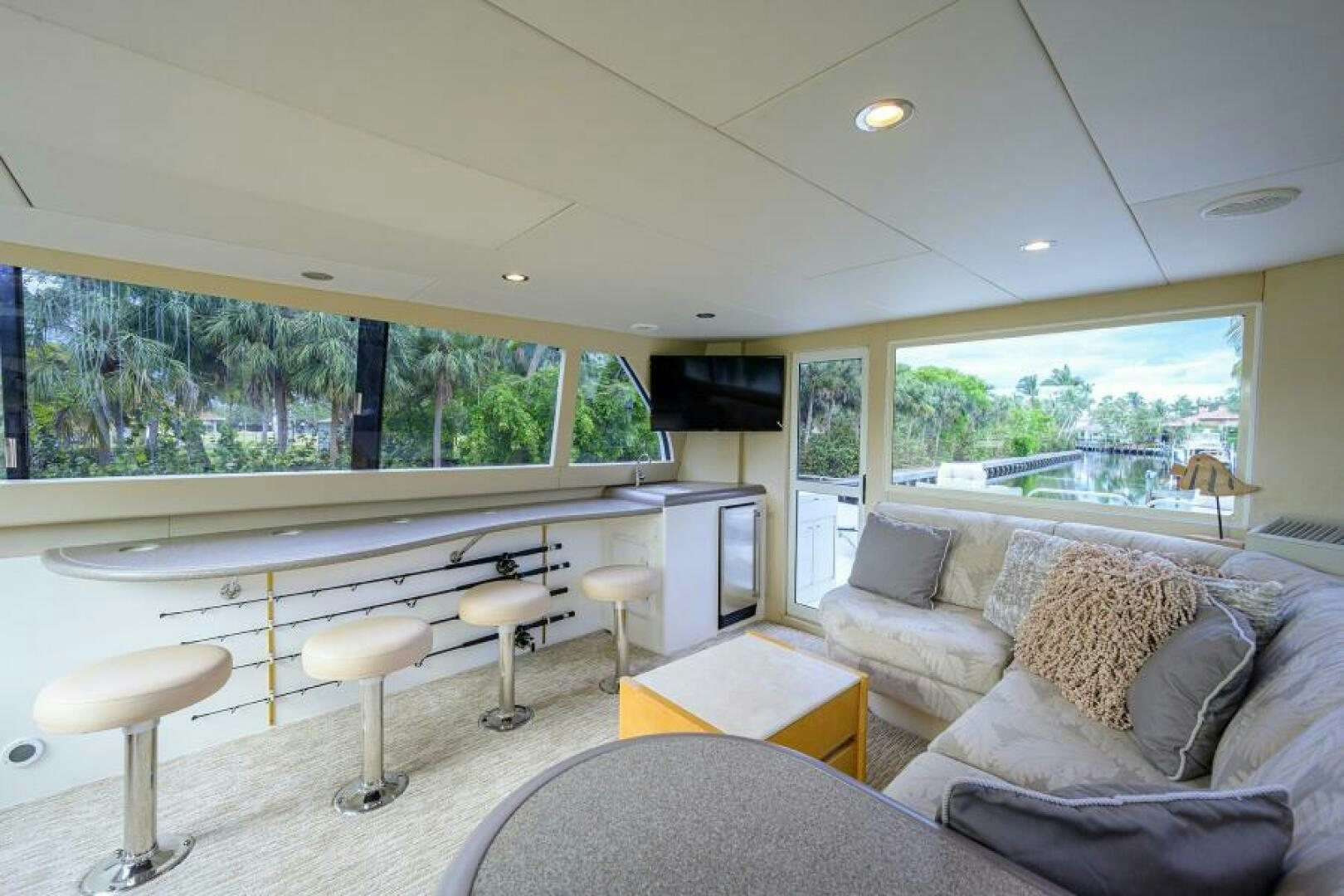 a living room with a large window aboard 80' LAZZARA Yacht for Sale
