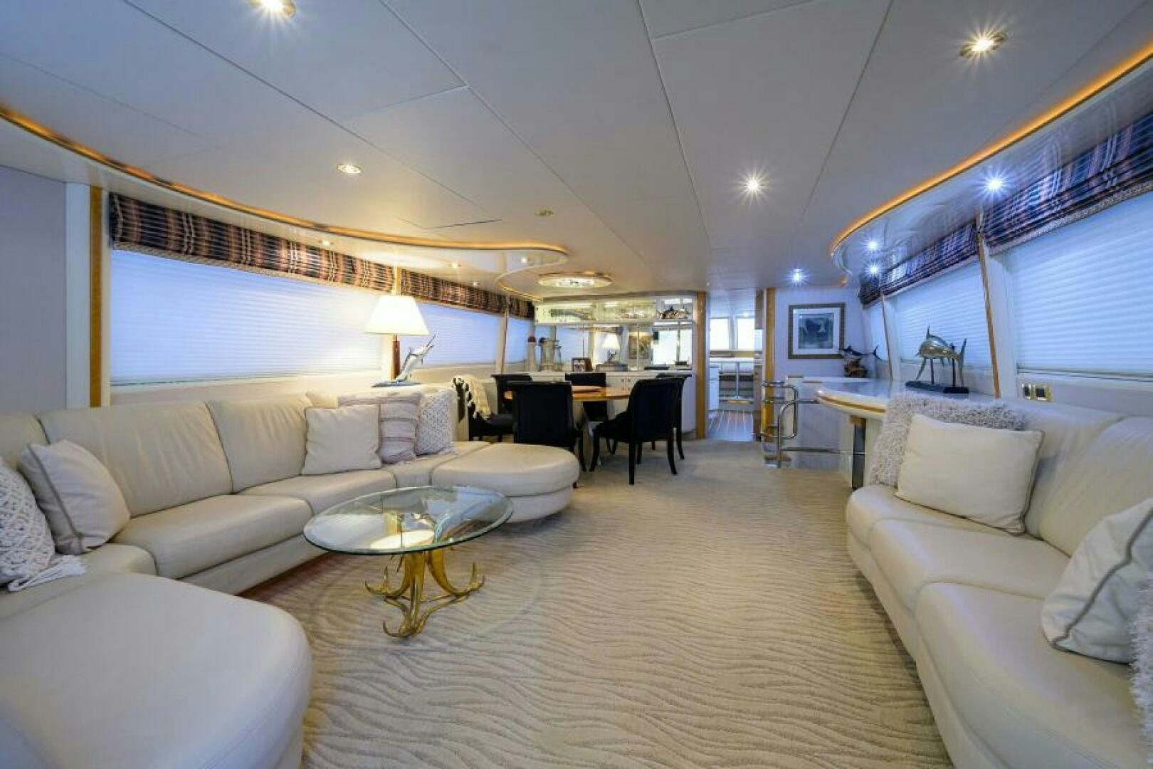 a living room with a large window aboard 80' LAZZARA Yacht for Sale