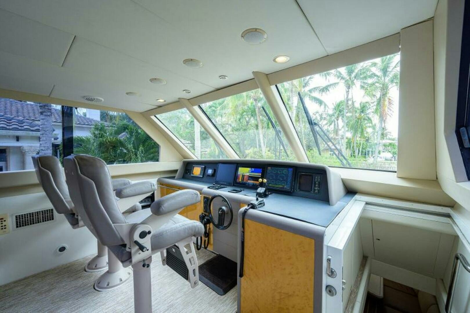 a room with a desk and chairs aboard 80' LAZZARA Yacht for Sale