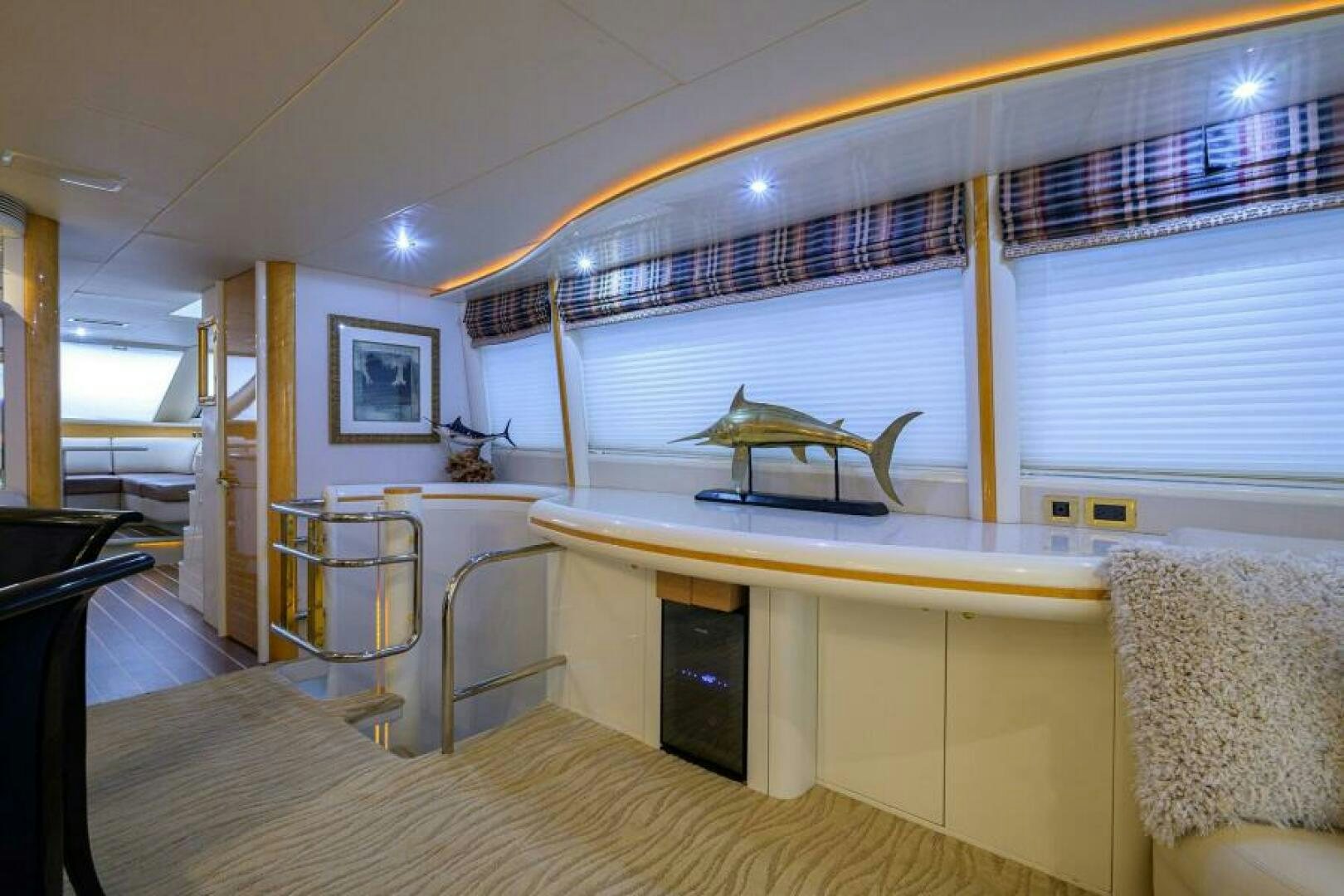 a room with a bed and a desk aboard 80' LAZZARA Yacht for Sale
