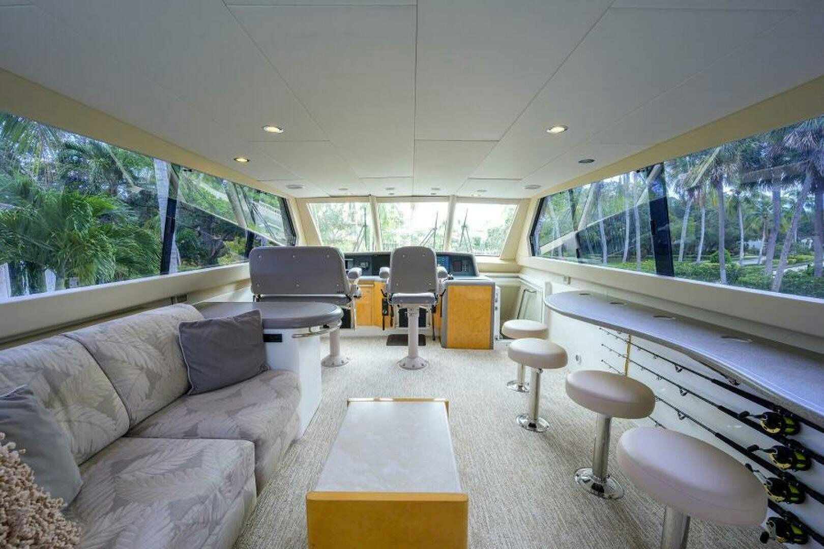 a living room with a large window aboard 80' LAZZARA Yacht for Sale
