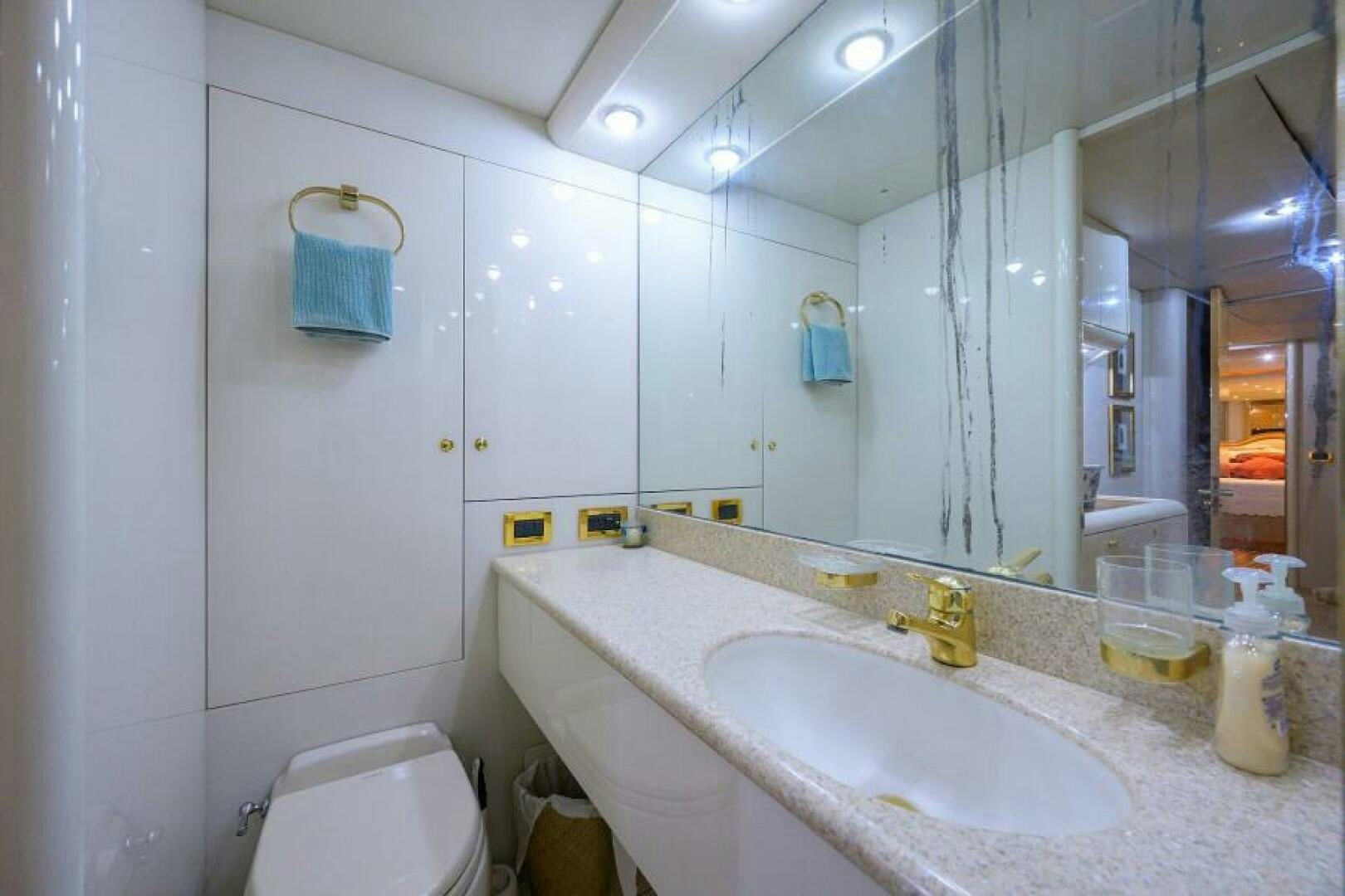 a bathroom with a sink and a toilet aboard 80' LAZZARA Yacht for Sale