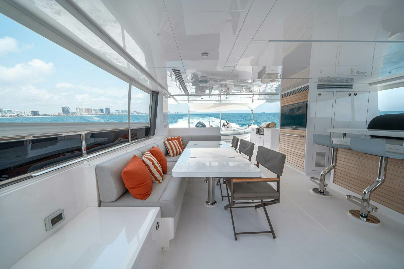 a room with a table and chairs aboard AFTER MIDNIGHT Yacht for Sale