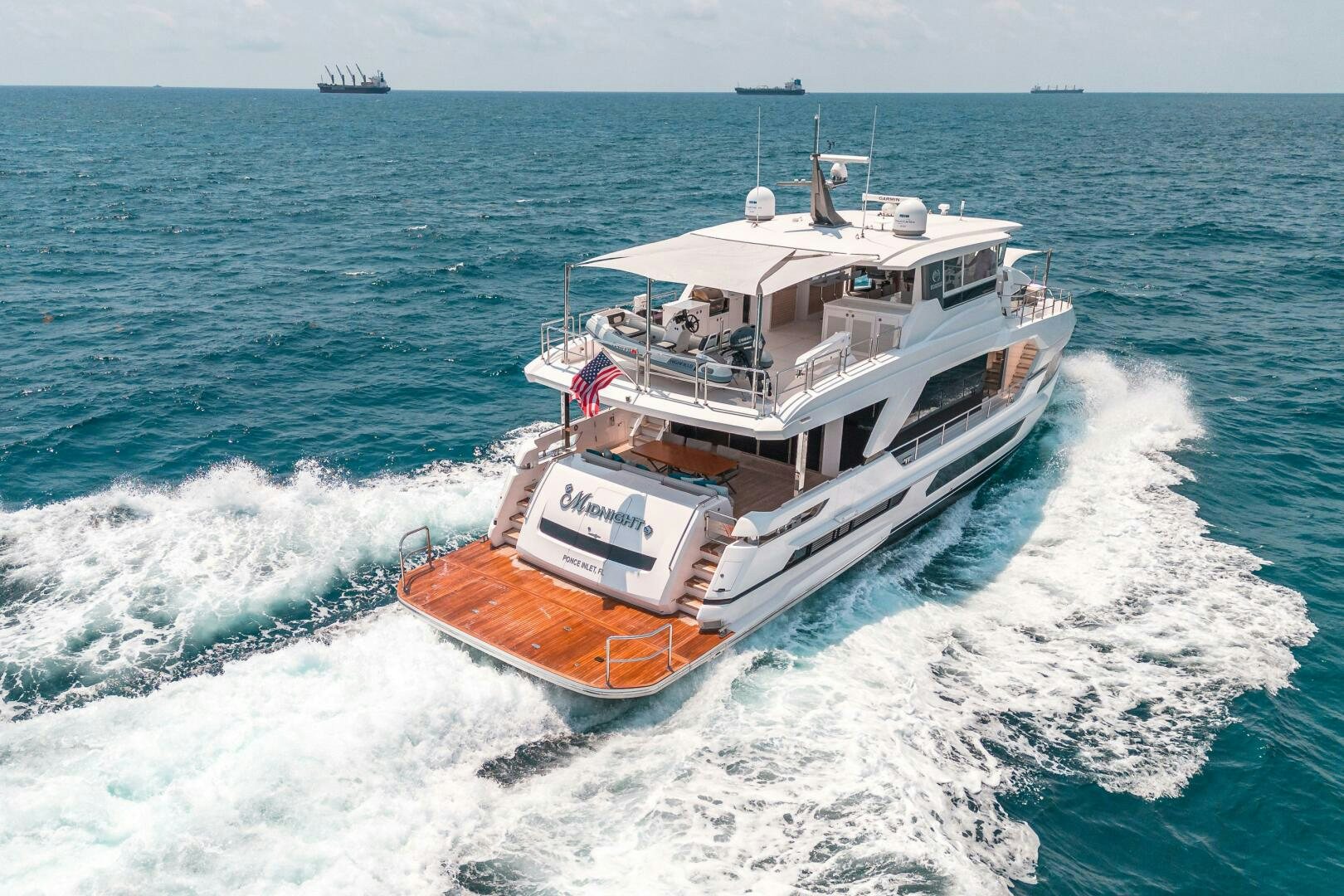 a boat on the water aboard AFTER MIDNIGHT Yacht for Sale