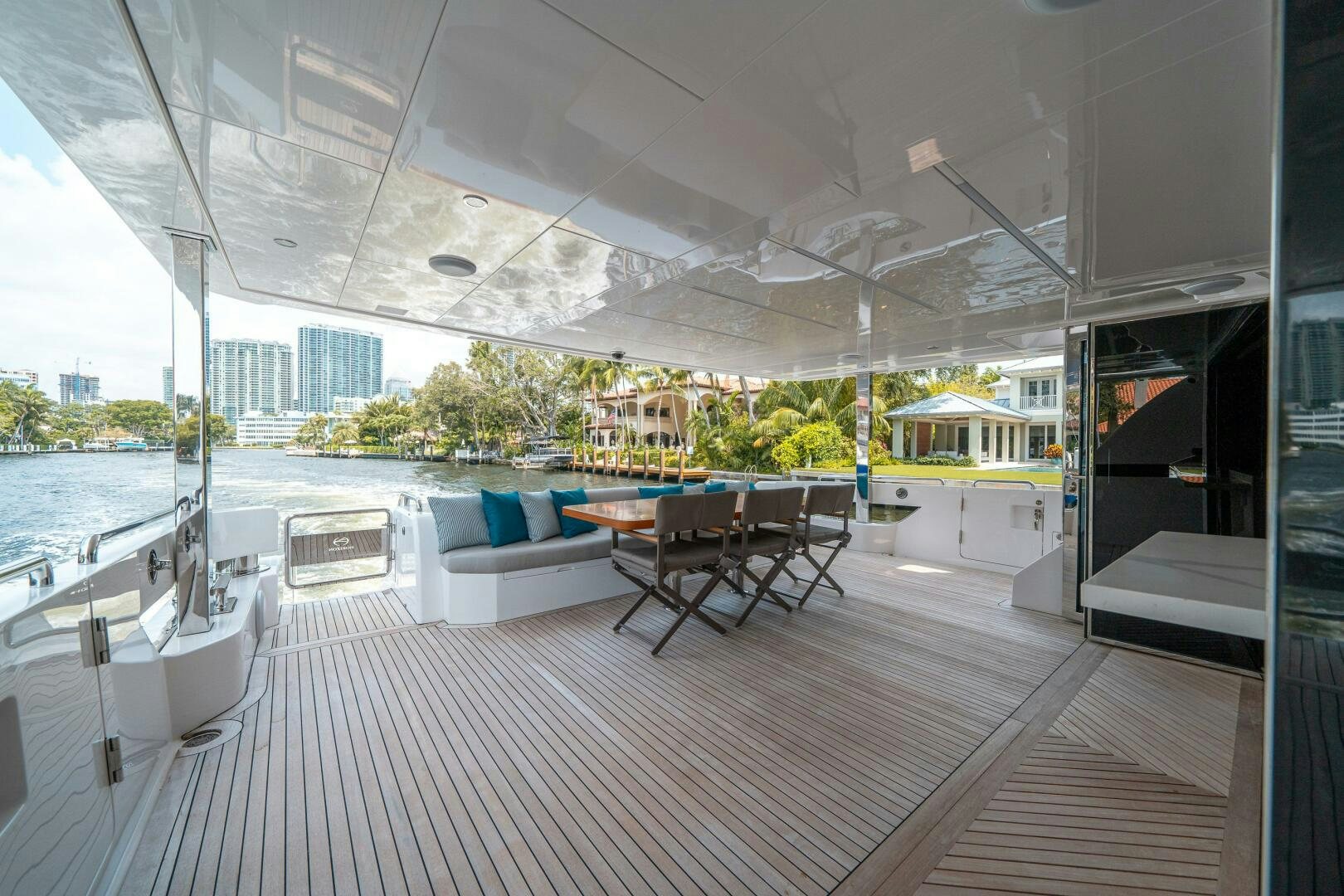 a room with a table and chairs aboard AFTER MIDNIGHT Yacht for Sale