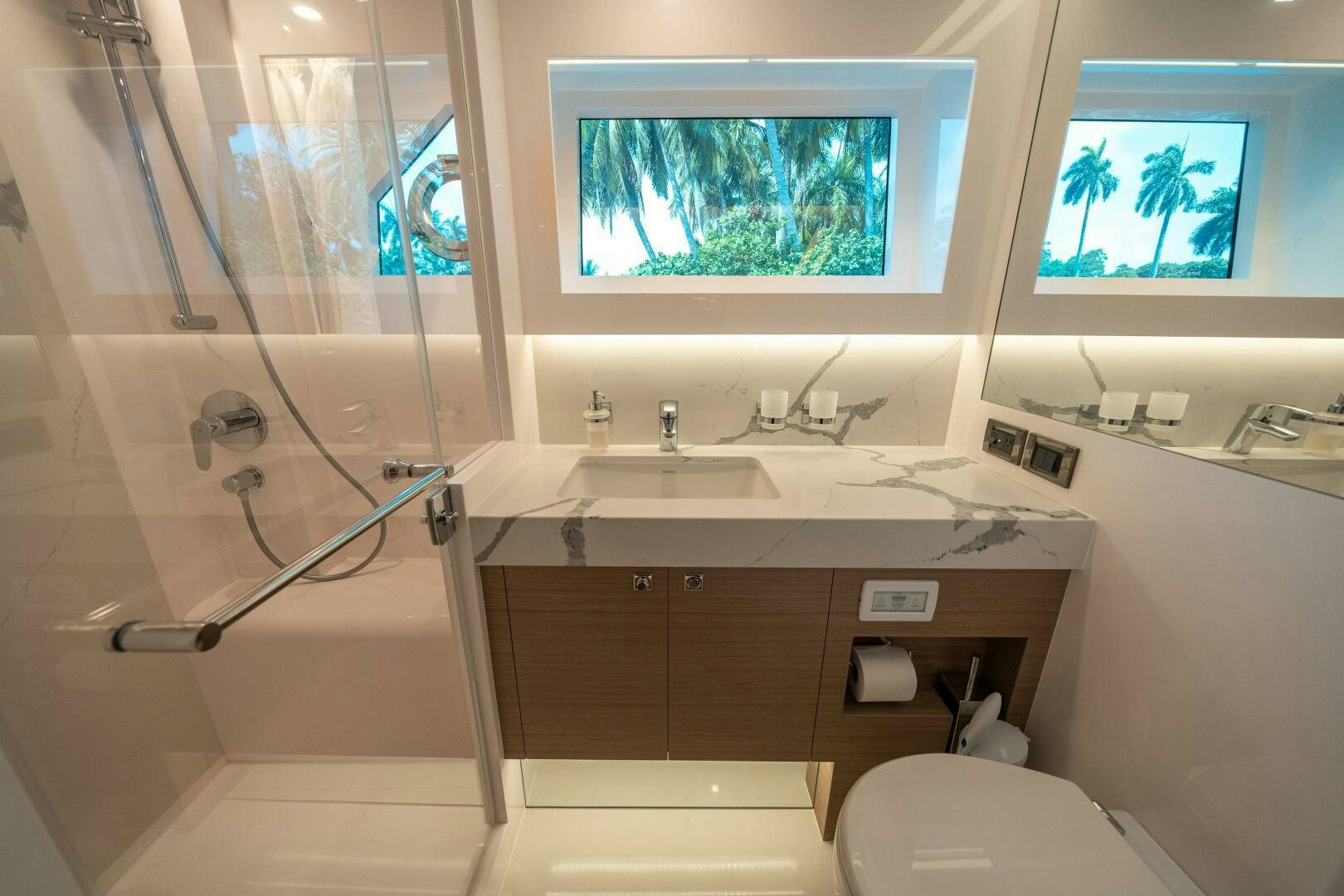 a bathroom with a glass shower aboard AFTER MIDNIGHT Yacht for Sale