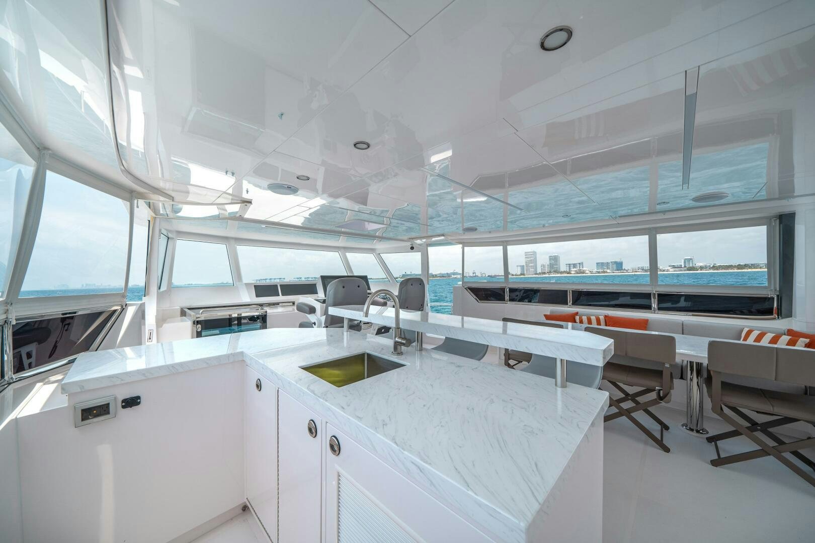 a room with white cabinets and a large window aboard AFTER MIDNIGHT Yacht for Sale