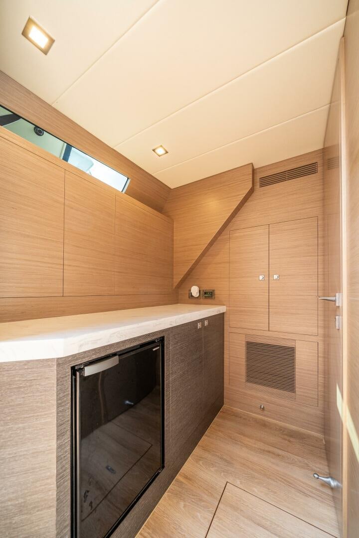 a kitchen with wooden cabinets aboard AFTER MIDNIGHT Yacht for Sale