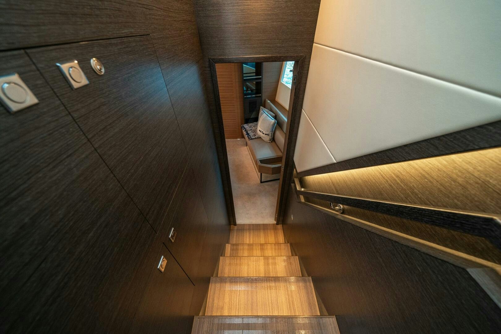 a wood floor with a wood floor and a wood cabinet with drawers aboard AFTER MIDNIGHT Yacht for Sale
