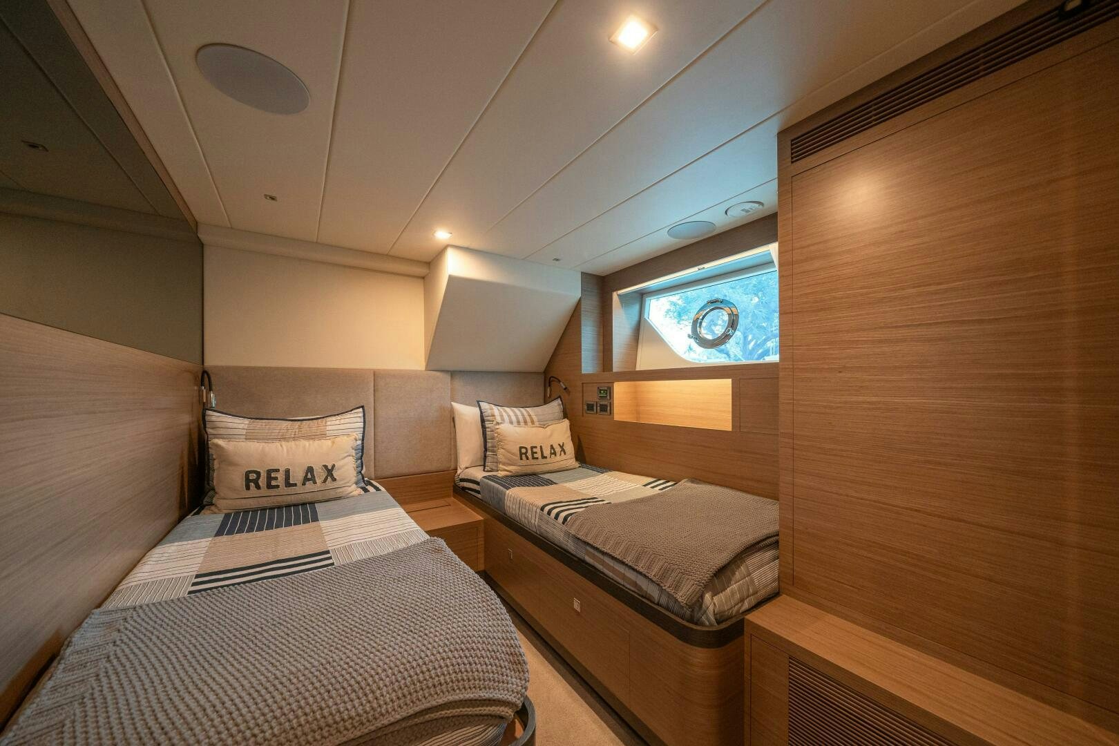 a room with two beds aboard AFTER MIDNIGHT Yacht for Sale