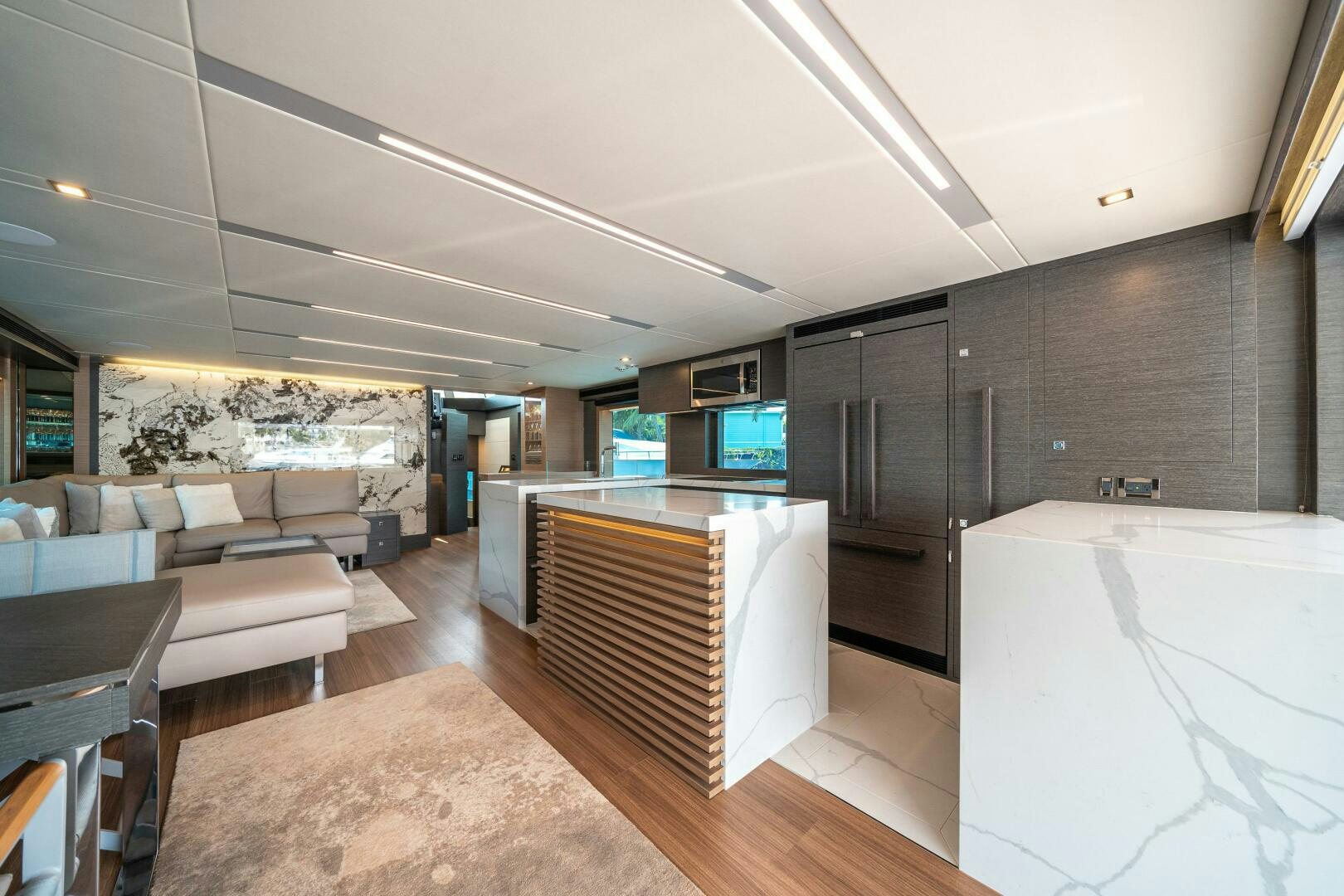 a room with a bed and a couch aboard AFTER MIDNIGHT Yacht for Sale