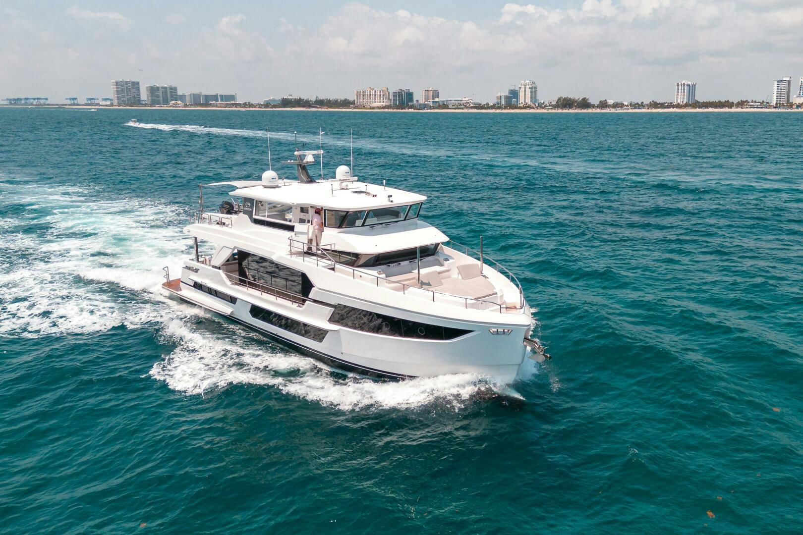a white boat on the water aboard AFTER MIDNIGHT Yacht for Sale
