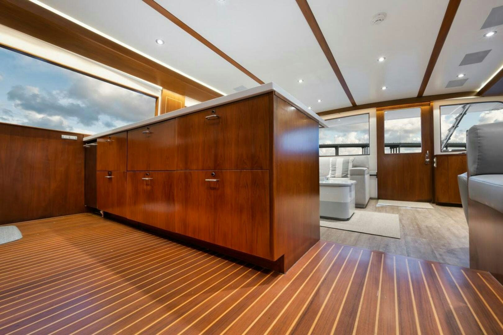 a wood room with a wood floor and a wood cabinet aboard BOXER Yacht for Sale