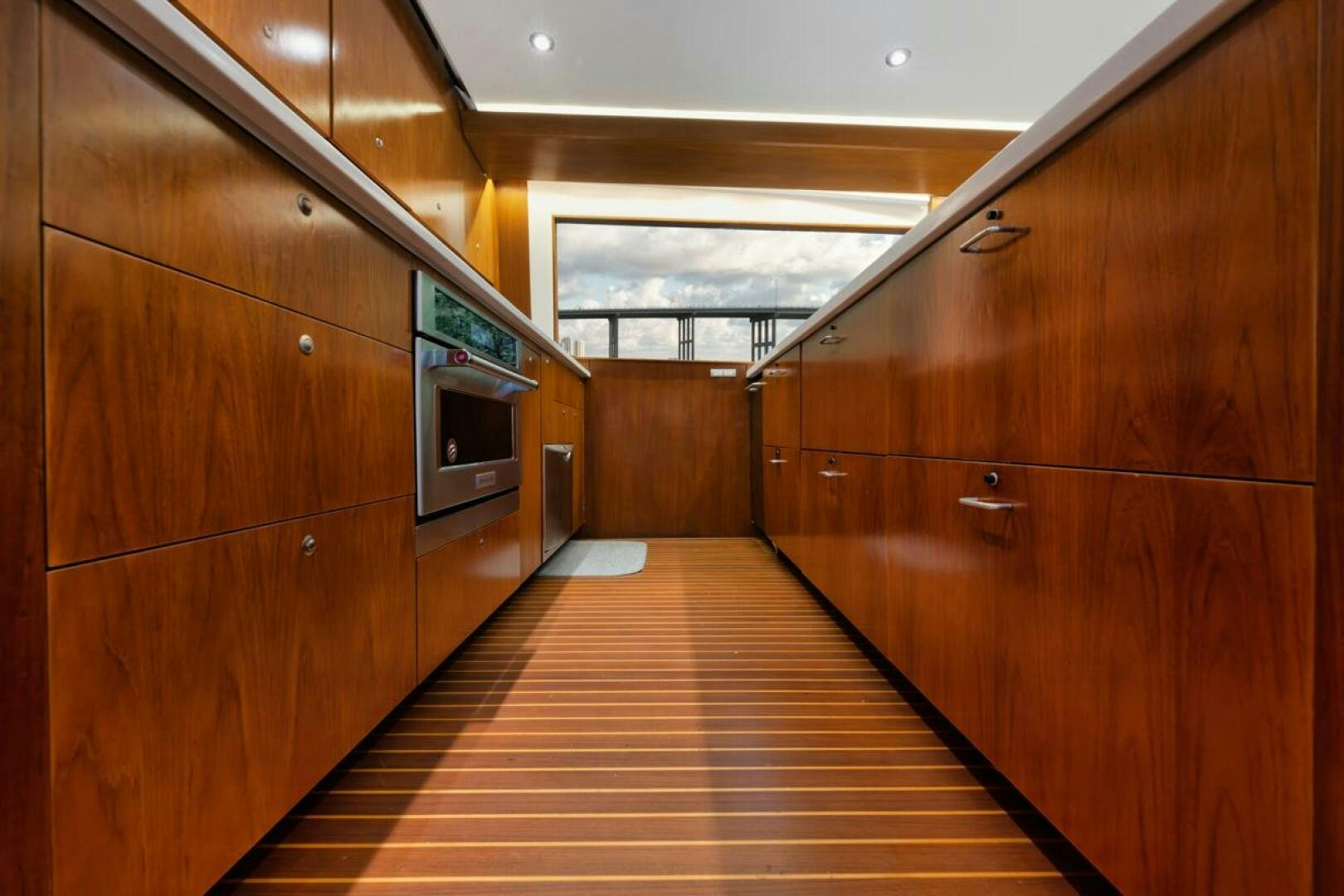 a long wooden hallway aboard BOXER Yacht for Sale