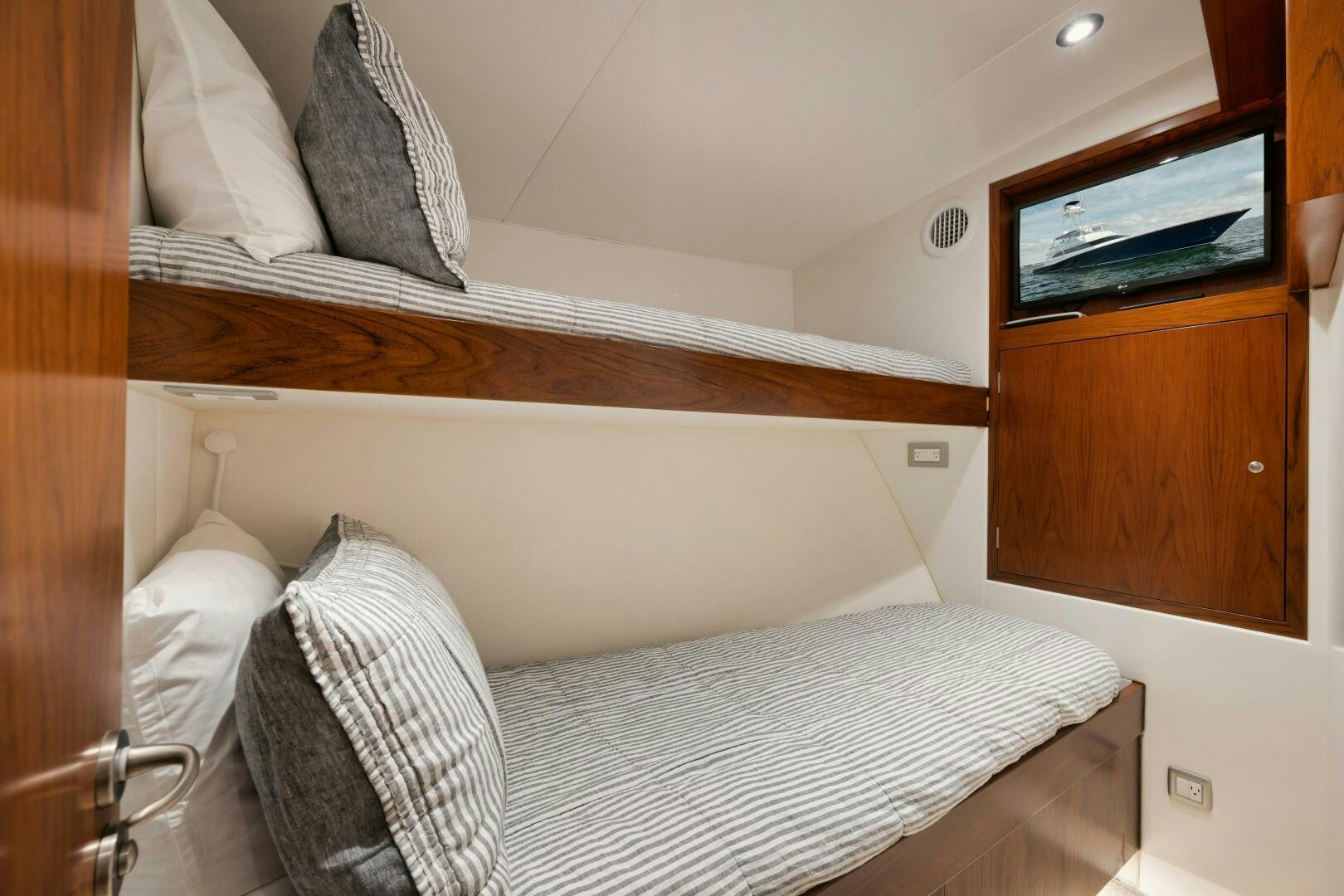a bed with white sheets aboard BOXER Yacht for Sale