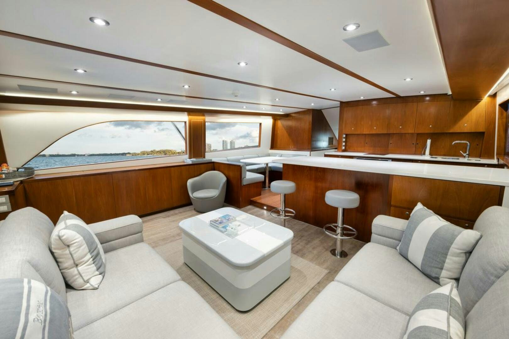 a room with a couch and a table and chairs aboard BOXER Yacht for Sale