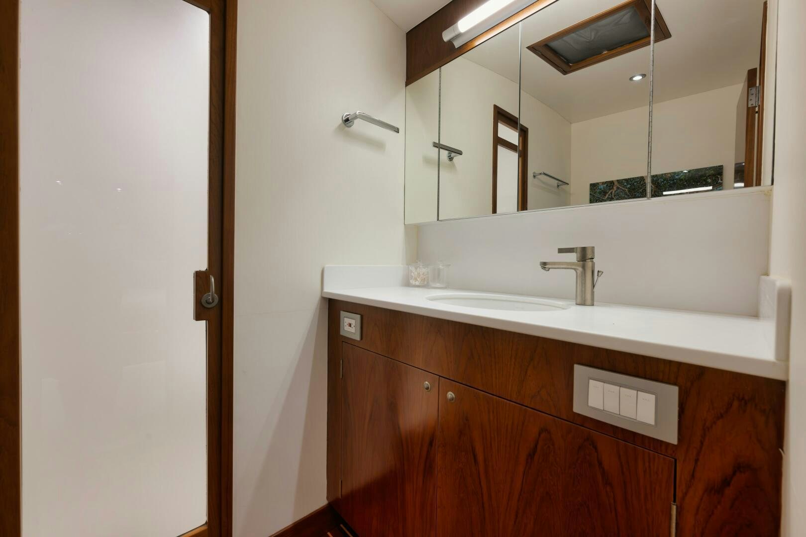 a bathroom with a large mirror aboard BOXER Yacht for Sale