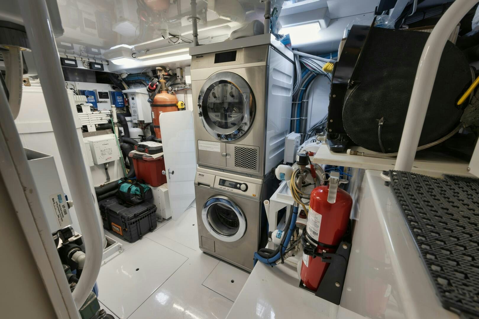 a room with a machine and a fan aboard BOXER Yacht for Sale