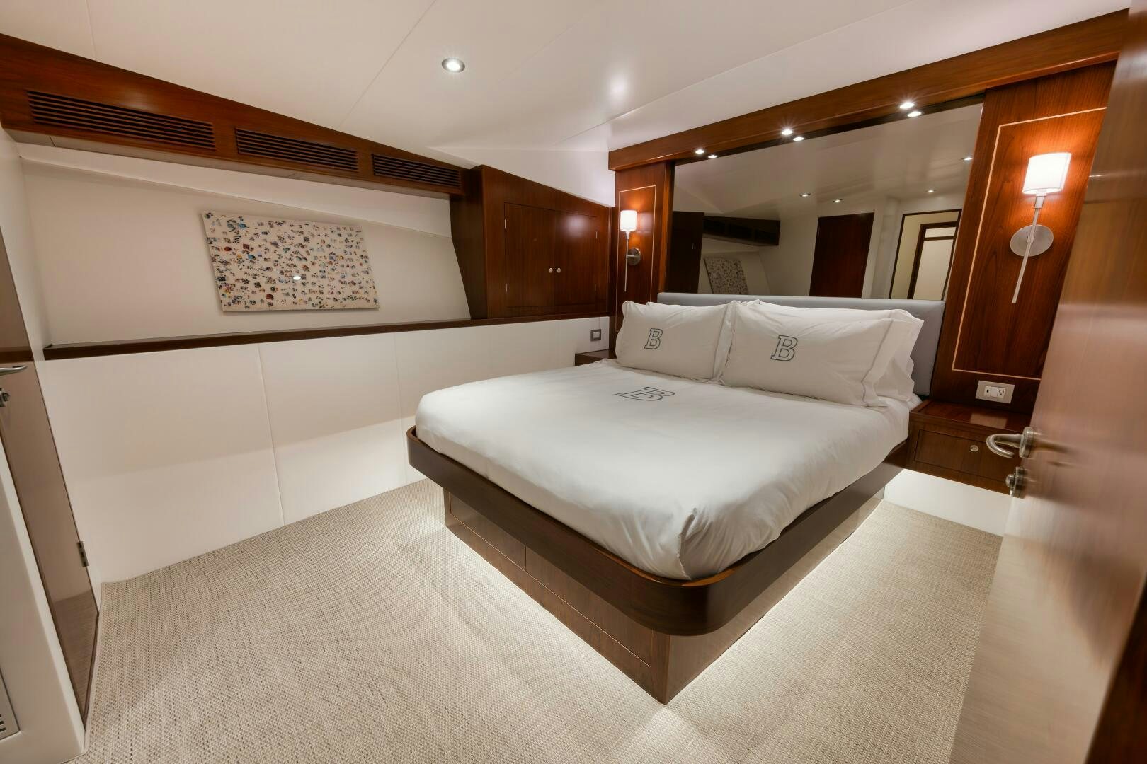 a large bedroom with a large bed aboard BOXER Yacht for Sale