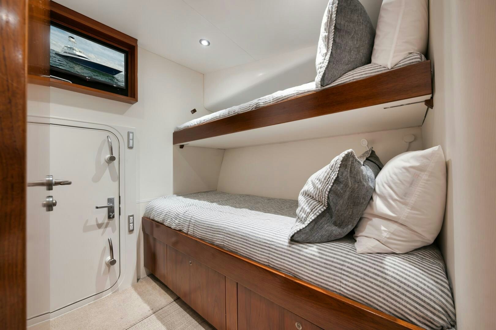 a bed with white pillows aboard BOXER Yacht for Sale
