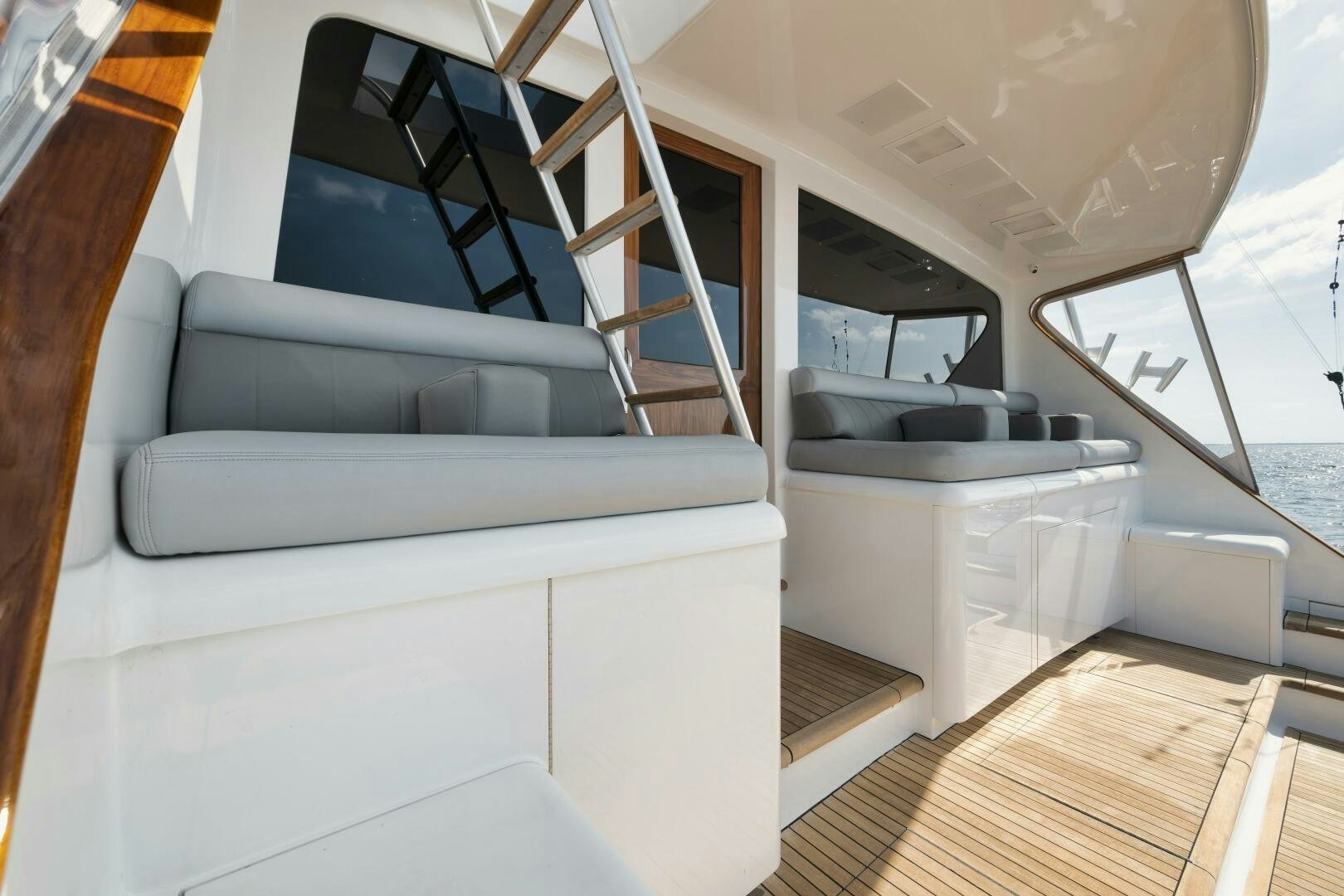 a boat with a couch aboard BOXER Yacht for Sale
