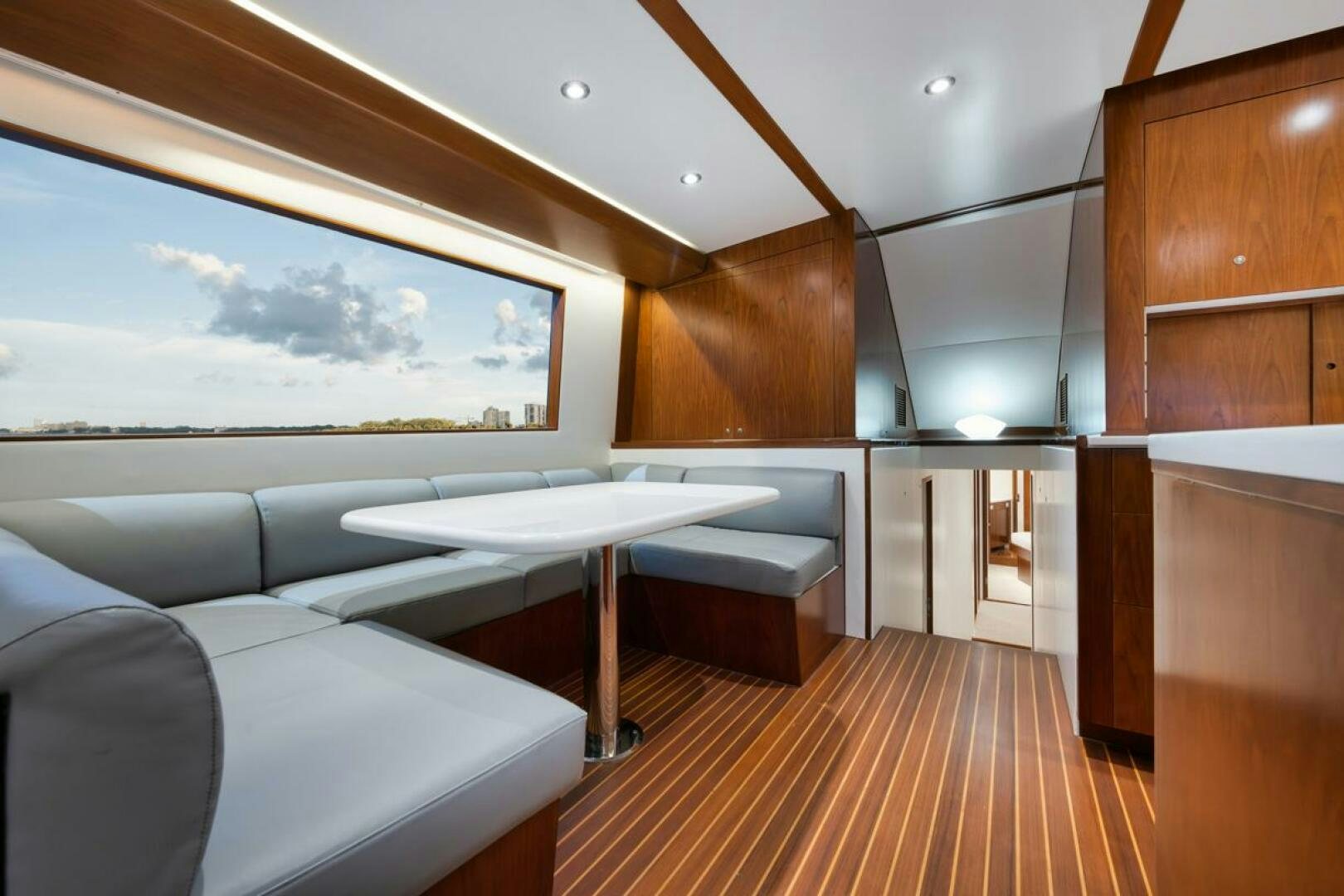 a room with a table and a bed aboard BOXER Yacht for Sale